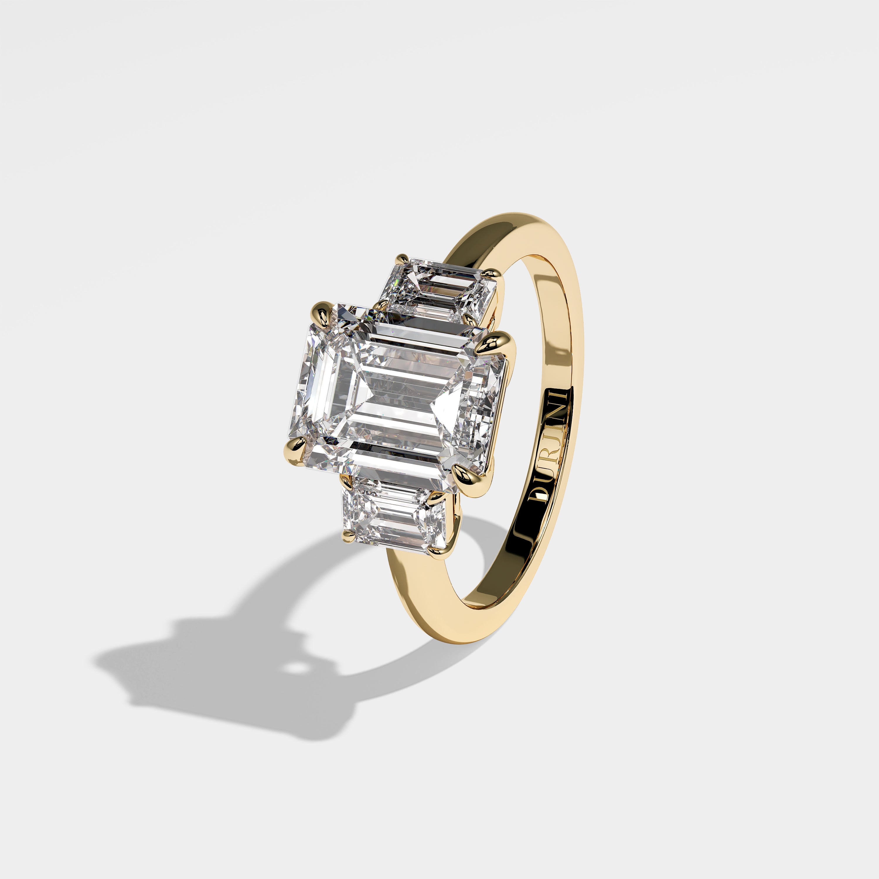 Rose emerald-cut diamond engagement ring in 18K yellow gold by Kurbãni Durjini, left side view