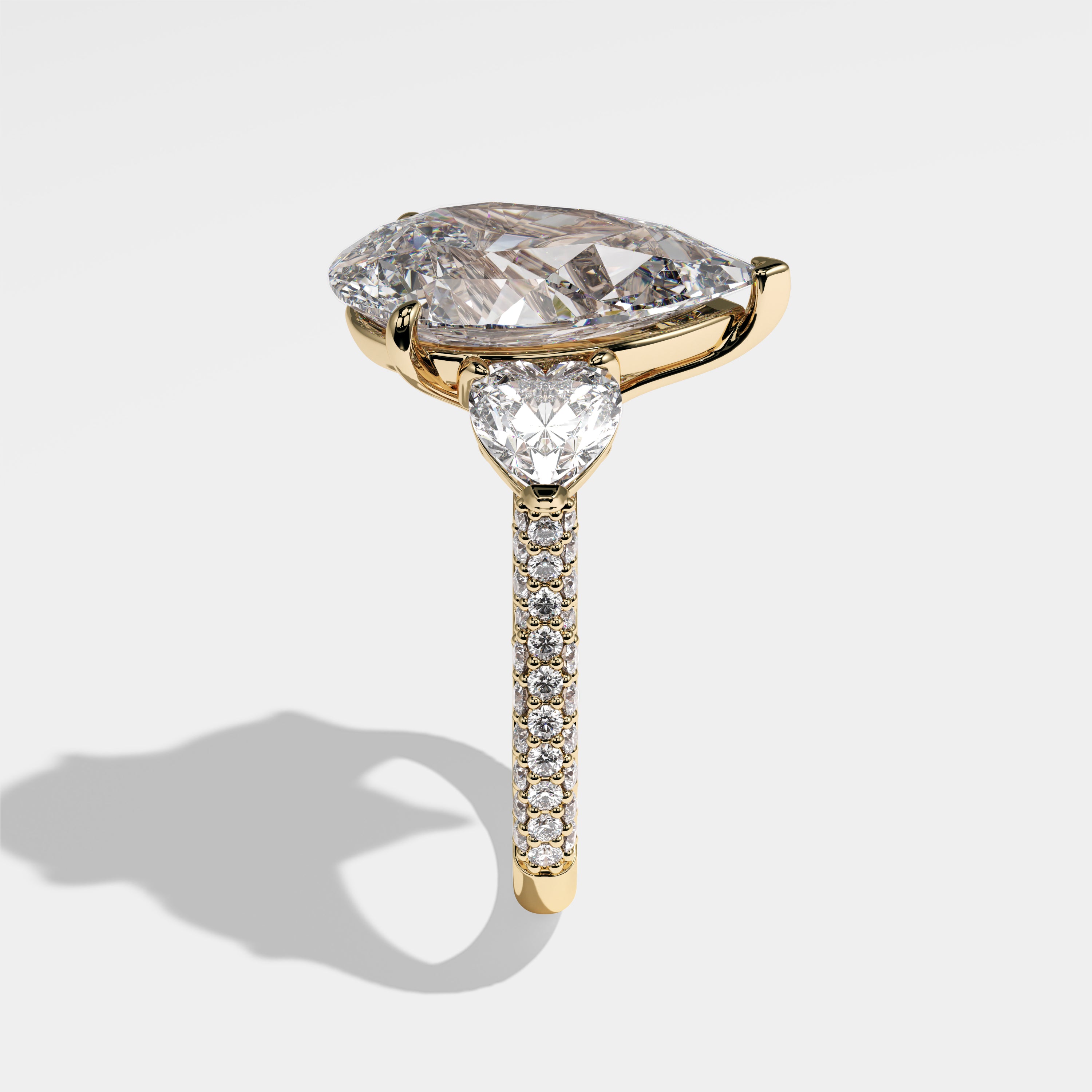 Sara pear-cut diamond engagement ring in 18K yellow gold by Kurbãni Durjini, side view