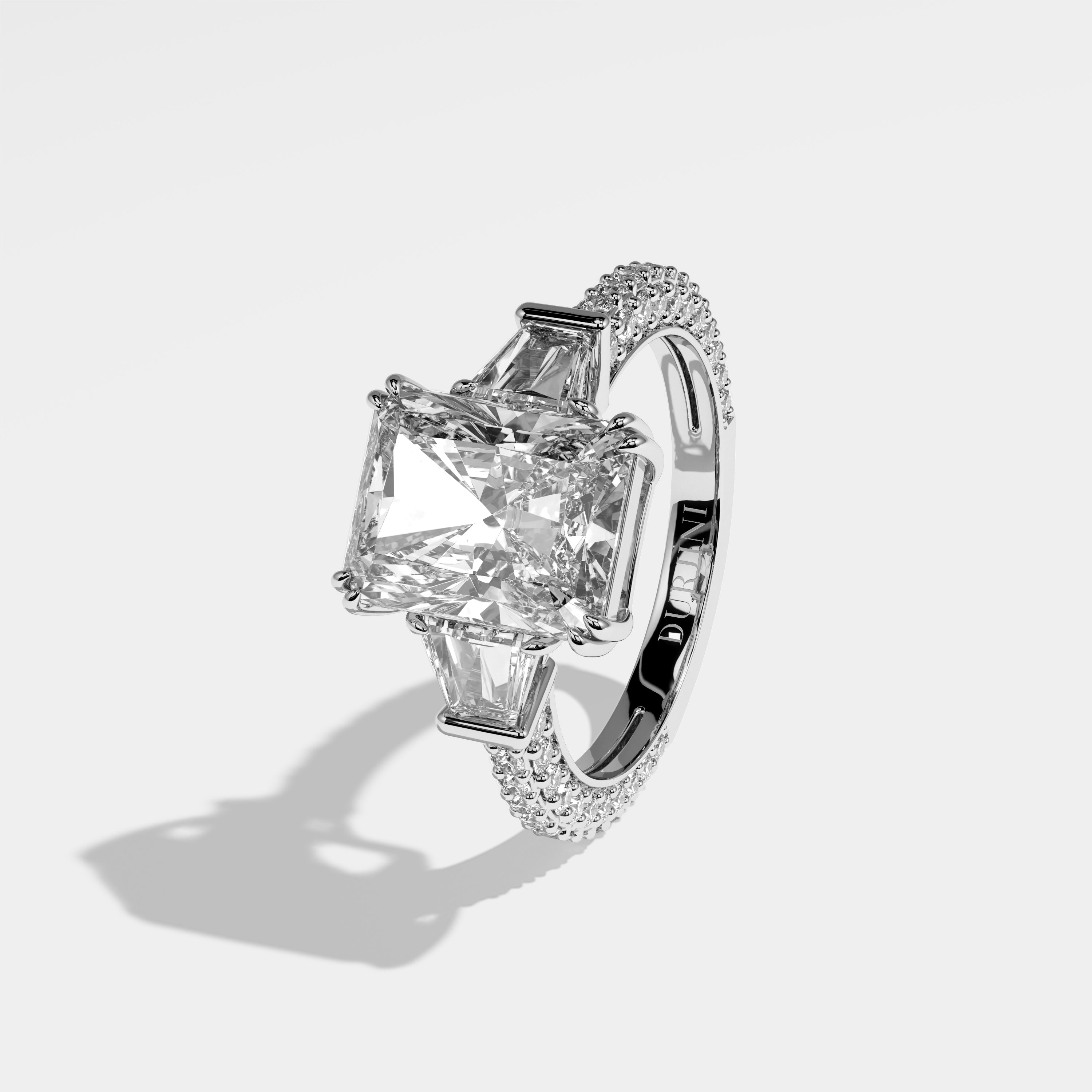 Alur radiant-cut diamond engagement ring in 18K white gold by Kurbãni Durjini, left side view