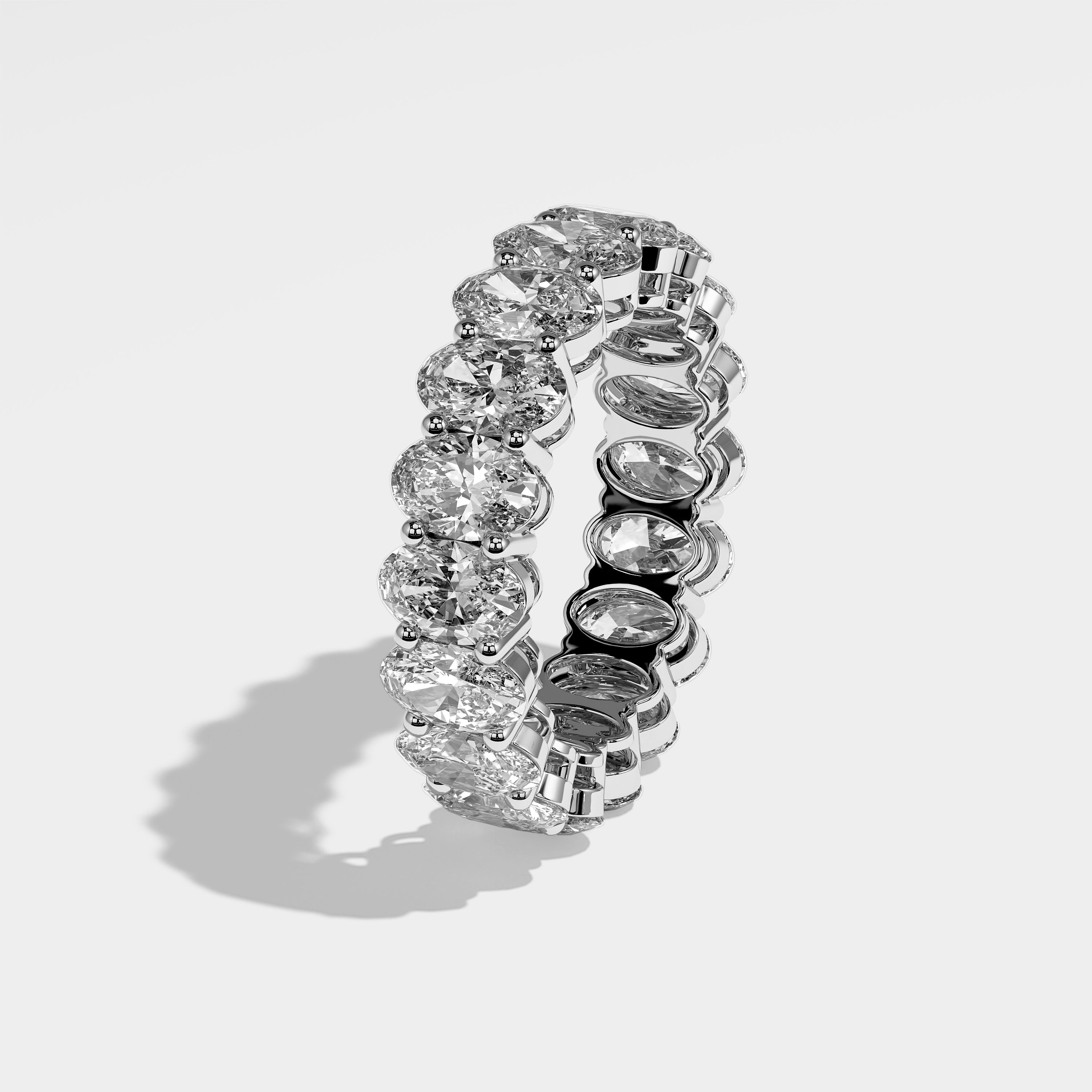 Honey oval-cut eternity diamond engagement ring in 18K white gold by Kurbãni Durjini, left side view