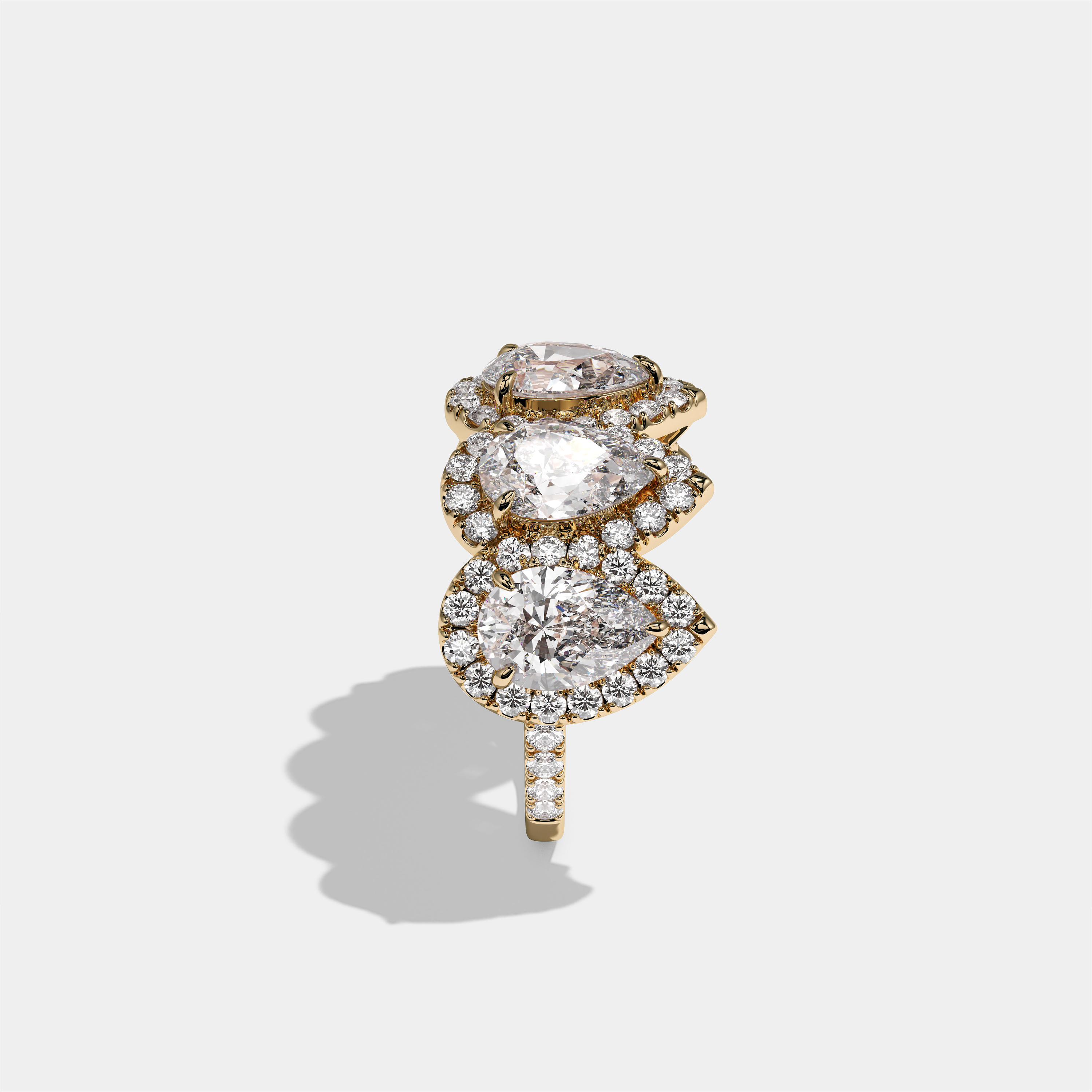Maud Countess pear halo diamond engagement ring in 18K yellow gold by Kurbãni Durjini, side view