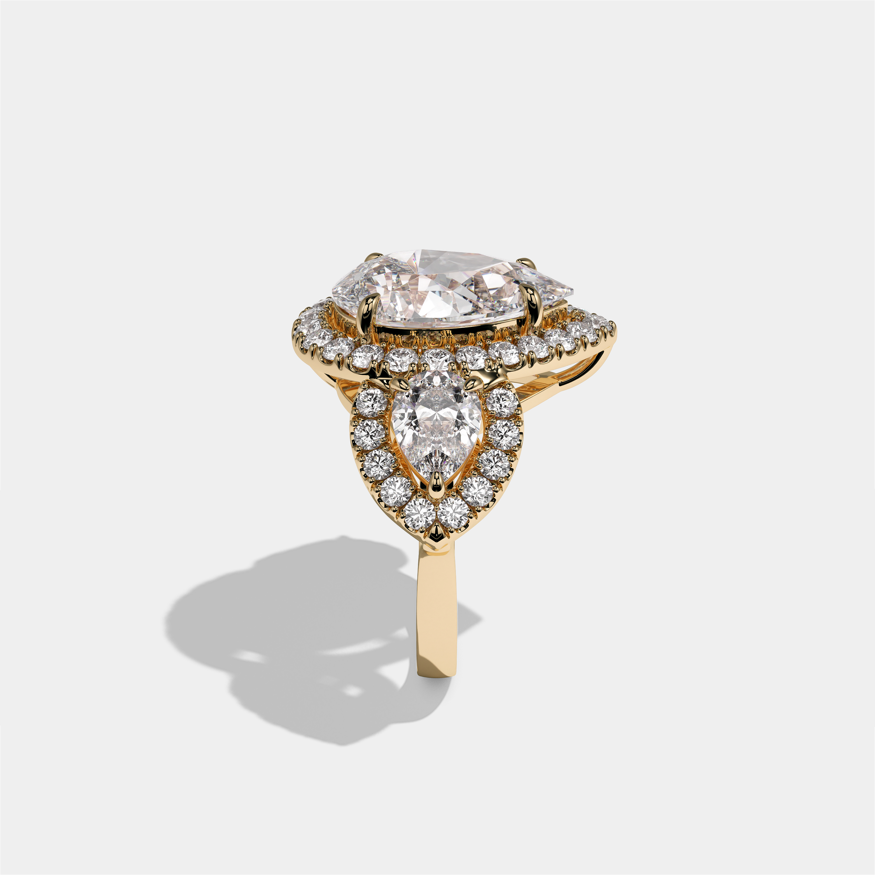 Dorothea Duchess diamond pear halo engagement ring in 18K yellow gold by Kurbãni Durjini, side view