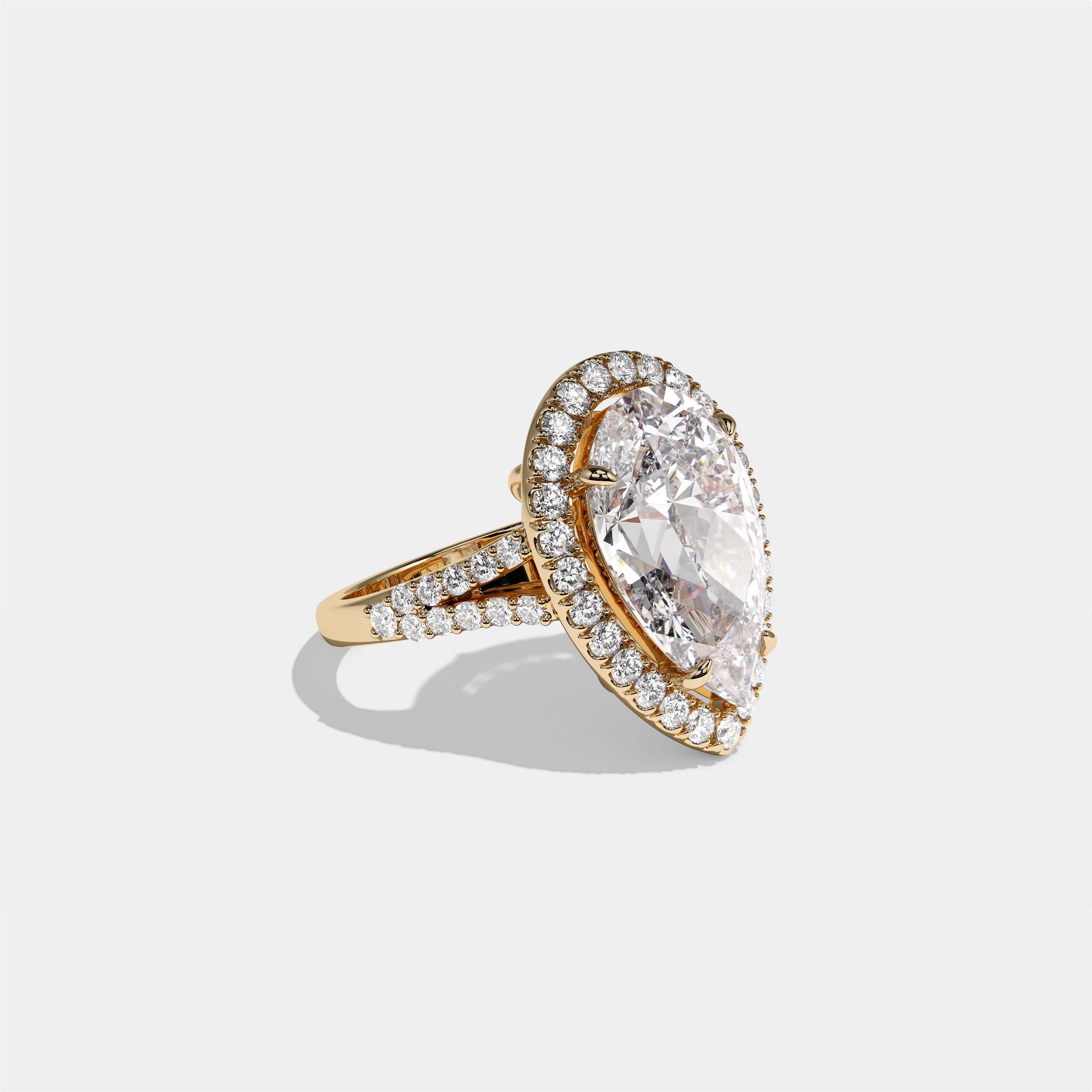 Helena Viscountess diamond pear halo engagement ring in 18K yellow gold by Kurbãni Durjini, right view