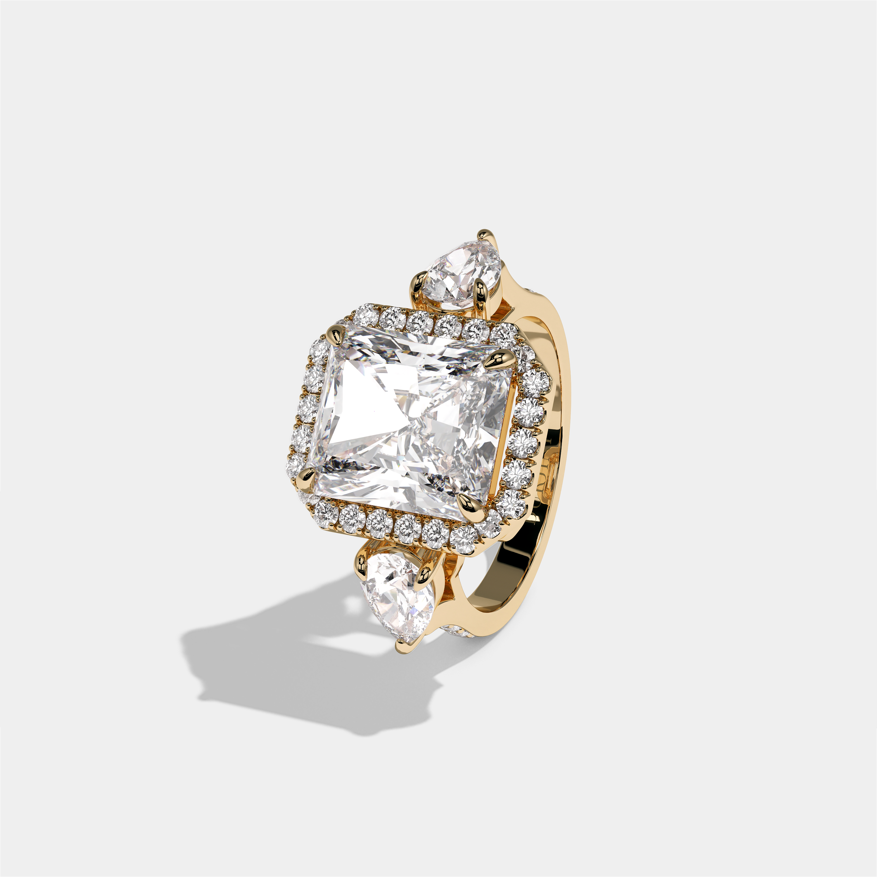 Marian Viscountess Letitia diamond radiant halo engagement ring in 18K yellow gold by Kurbãni Durjini, left view