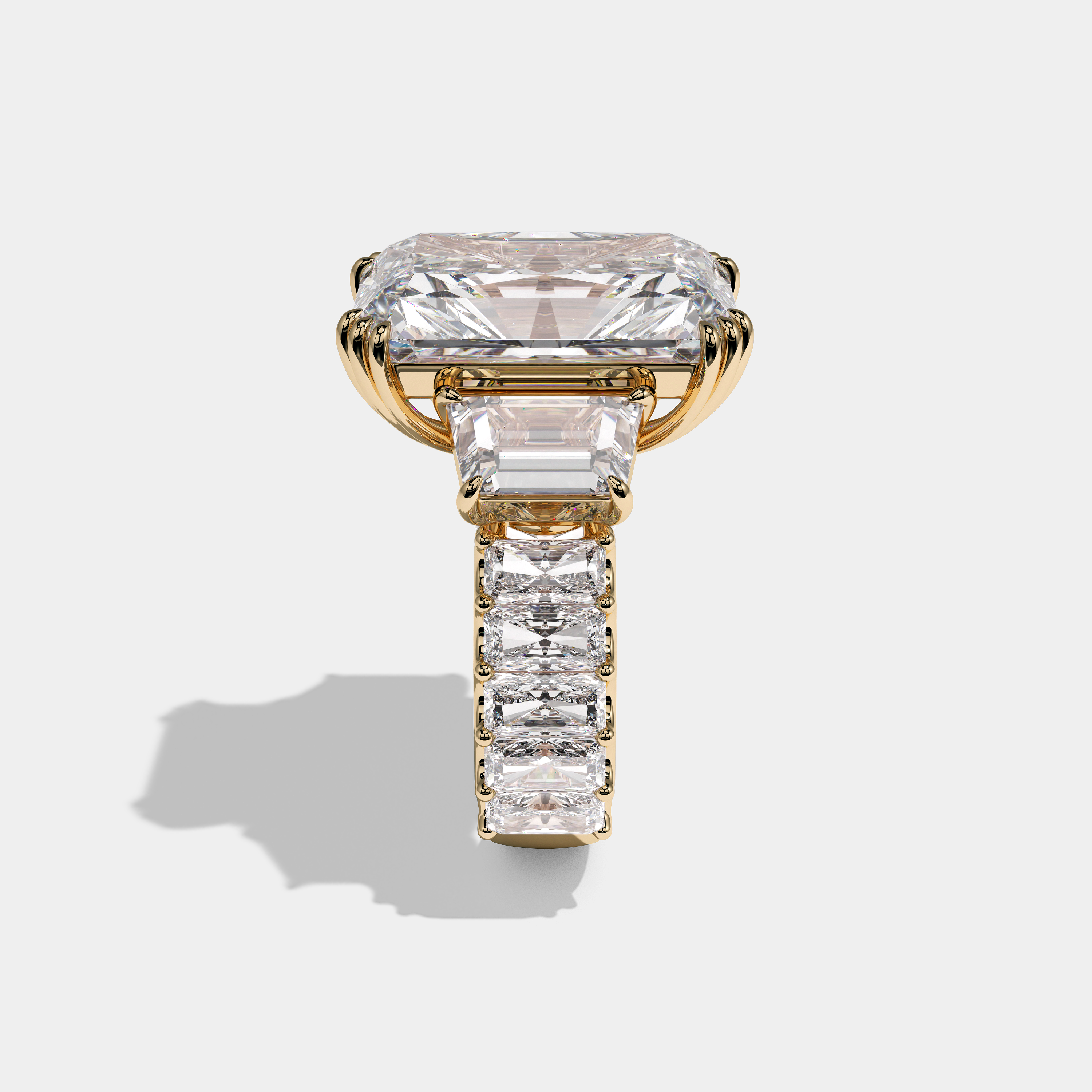 Etheldreda Lady of Ely diamond radiant halo engagement ring in 18K yellow gold by Kurbãni Durjini, side view
