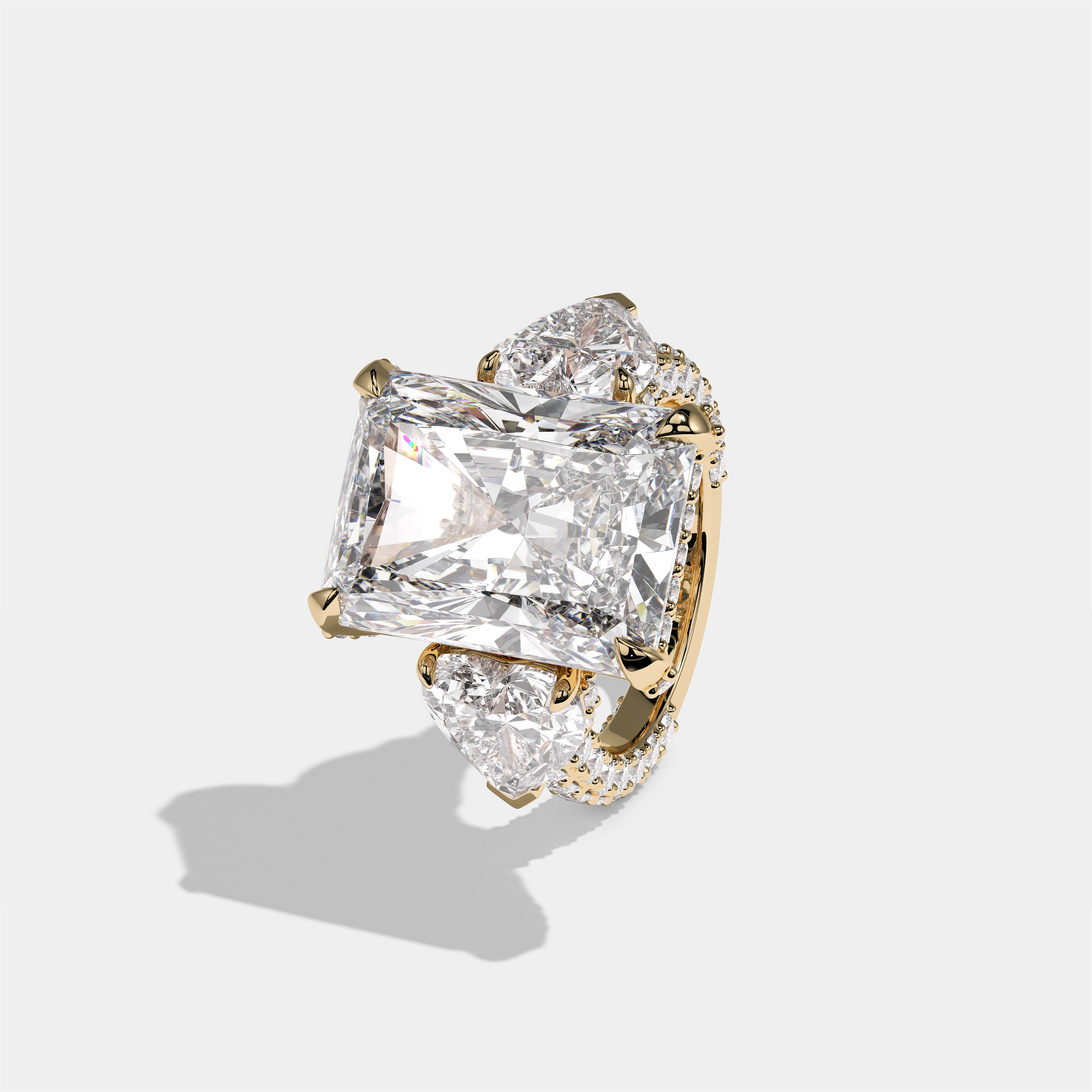 Chaya Lady Ravenscroft diamond radiant halo engagement ring in 18K yellow gold by Kurbãni Durjini, left view
