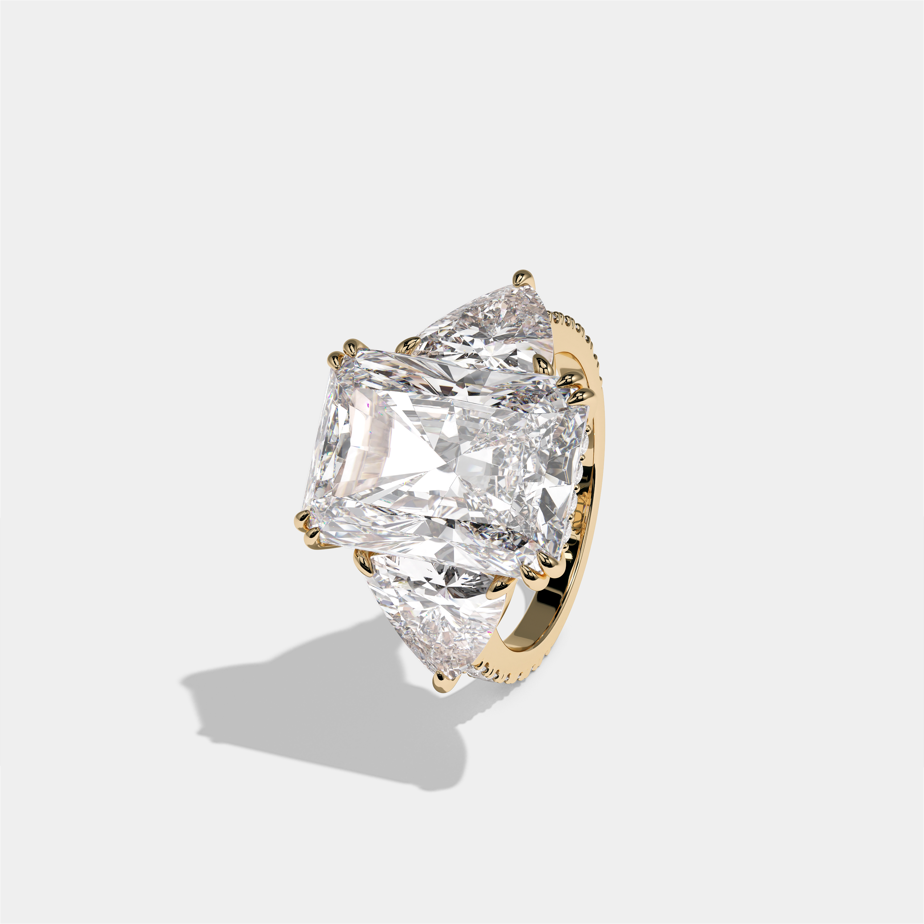 Tzipporah Lady Highbourne diamond radiant halo engagement ring in 18K yellow gold by Kurbãni Durjini, left view