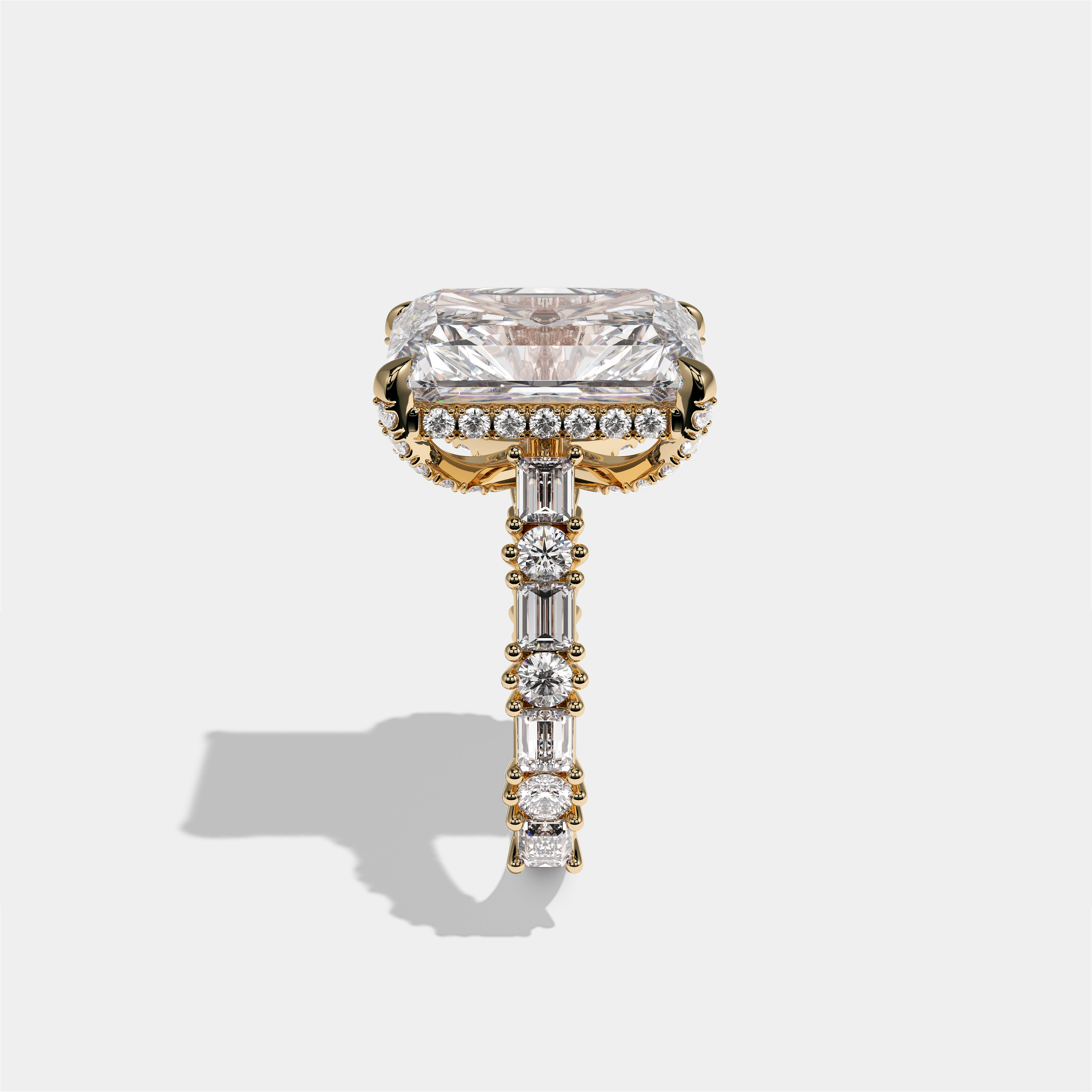 Ruth Lady Wetherfield diamond radiant halo engagement ring in 18K yellow gold by Kurbãni Durjini, side view