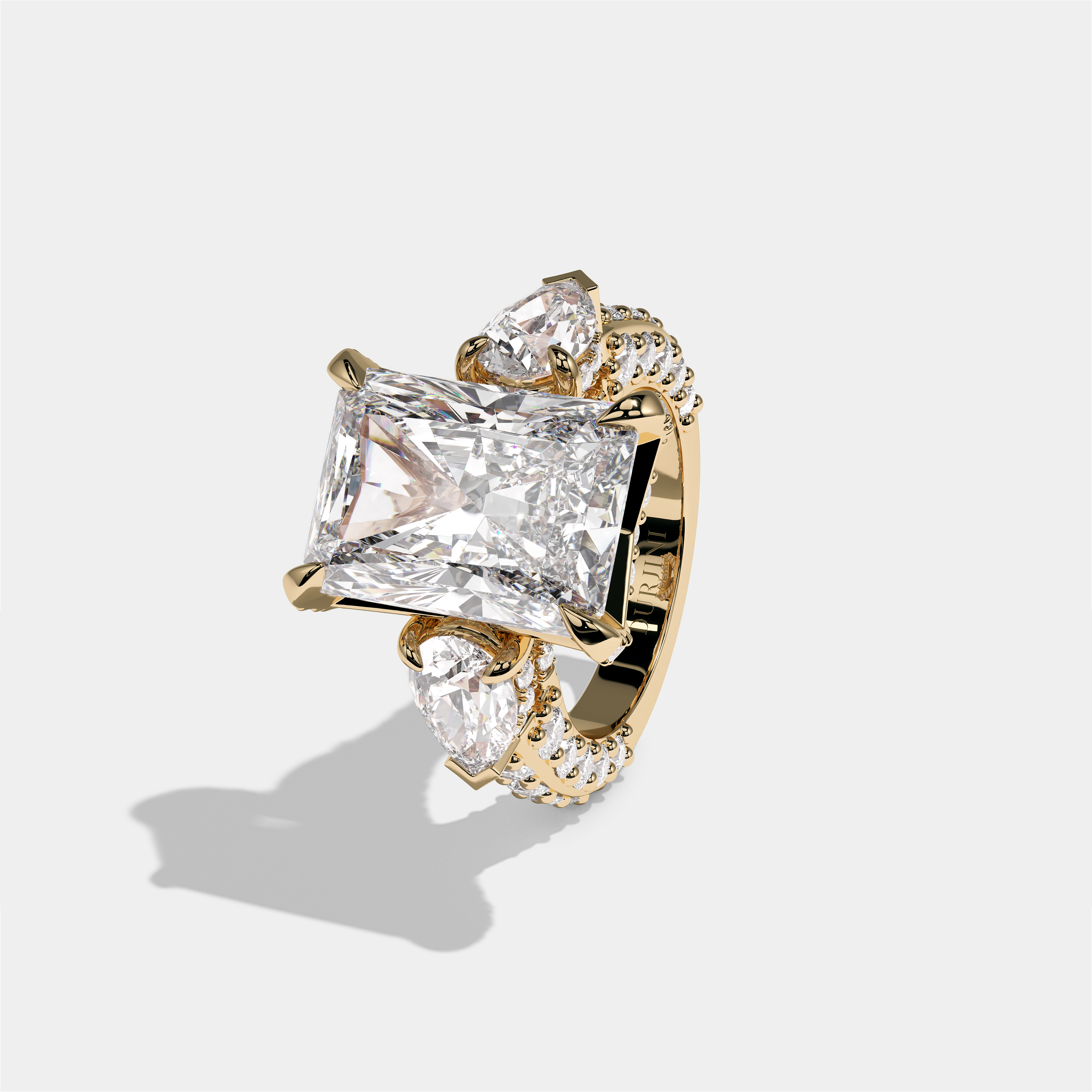 Hannah Eclat Kingsbridge diamond radiant halo engagement ring in 18K yellow gold by Kurbãni Durjini, left view