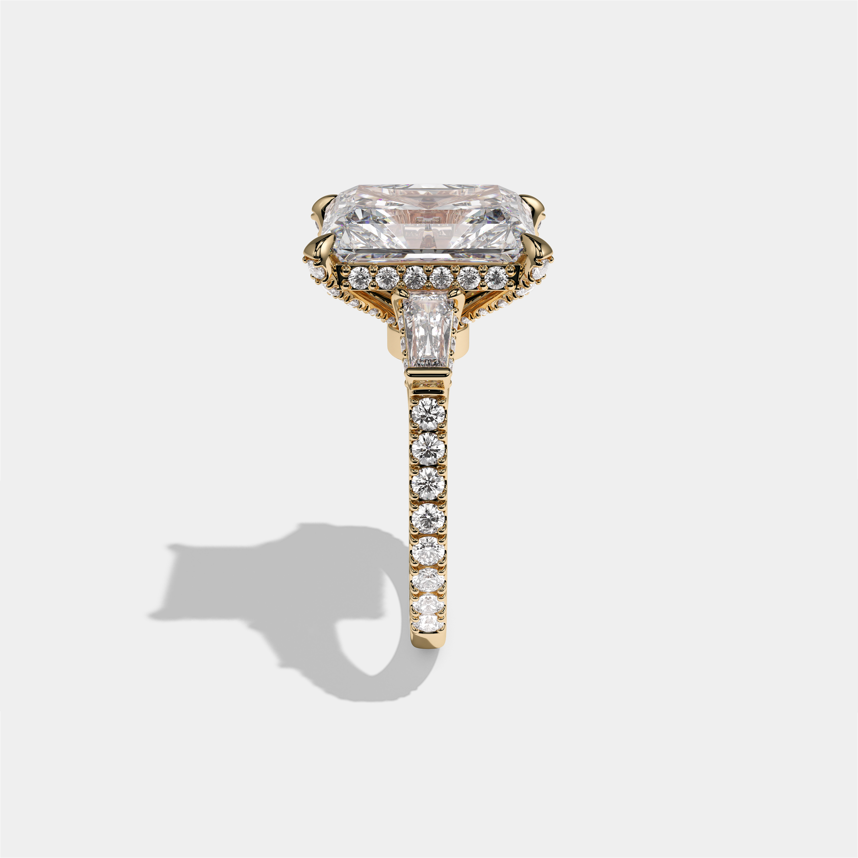 Esther Eclat Kingswood diamond radiant halo engagement ring in 18K yellow gold by Kurbãni Durjini, side view