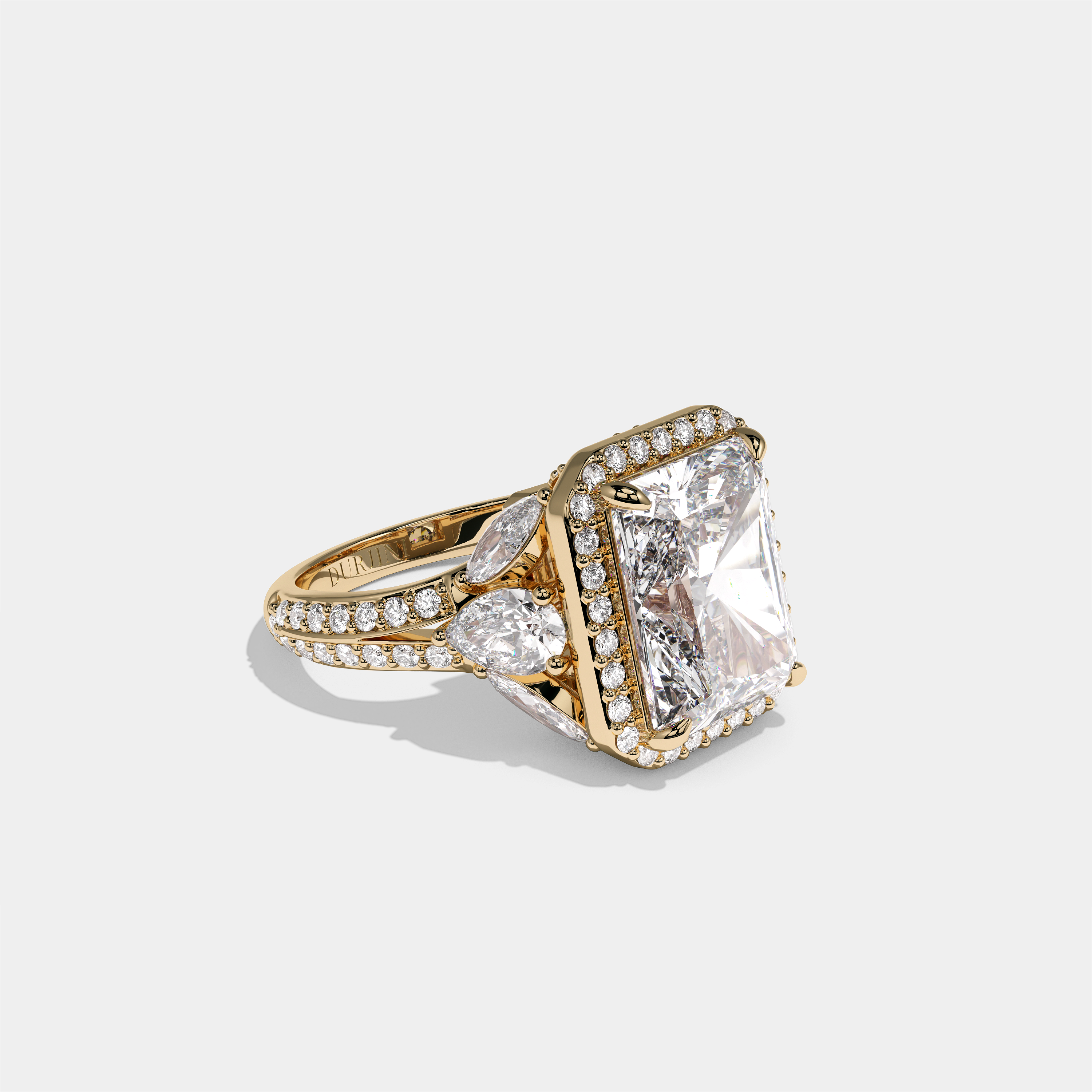Rina Eclat Ashbourne diamond radiant halo engagement ring in 18K yellow gold by Kurbãni Durjini, right view
