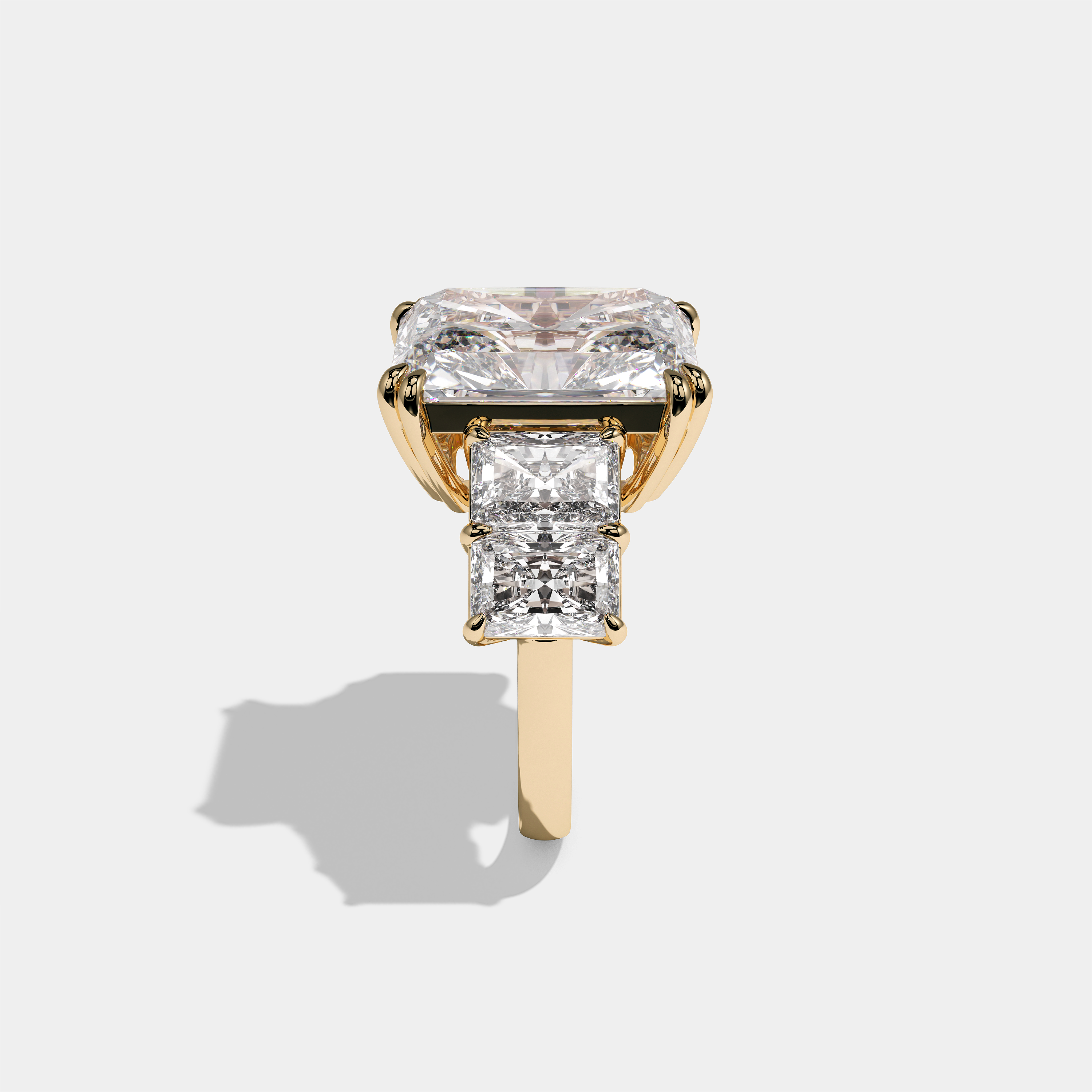 Hila Highgrove diamond radiant halo engagement ring in 18K yellow gold by Kurbãni Durjini, side view