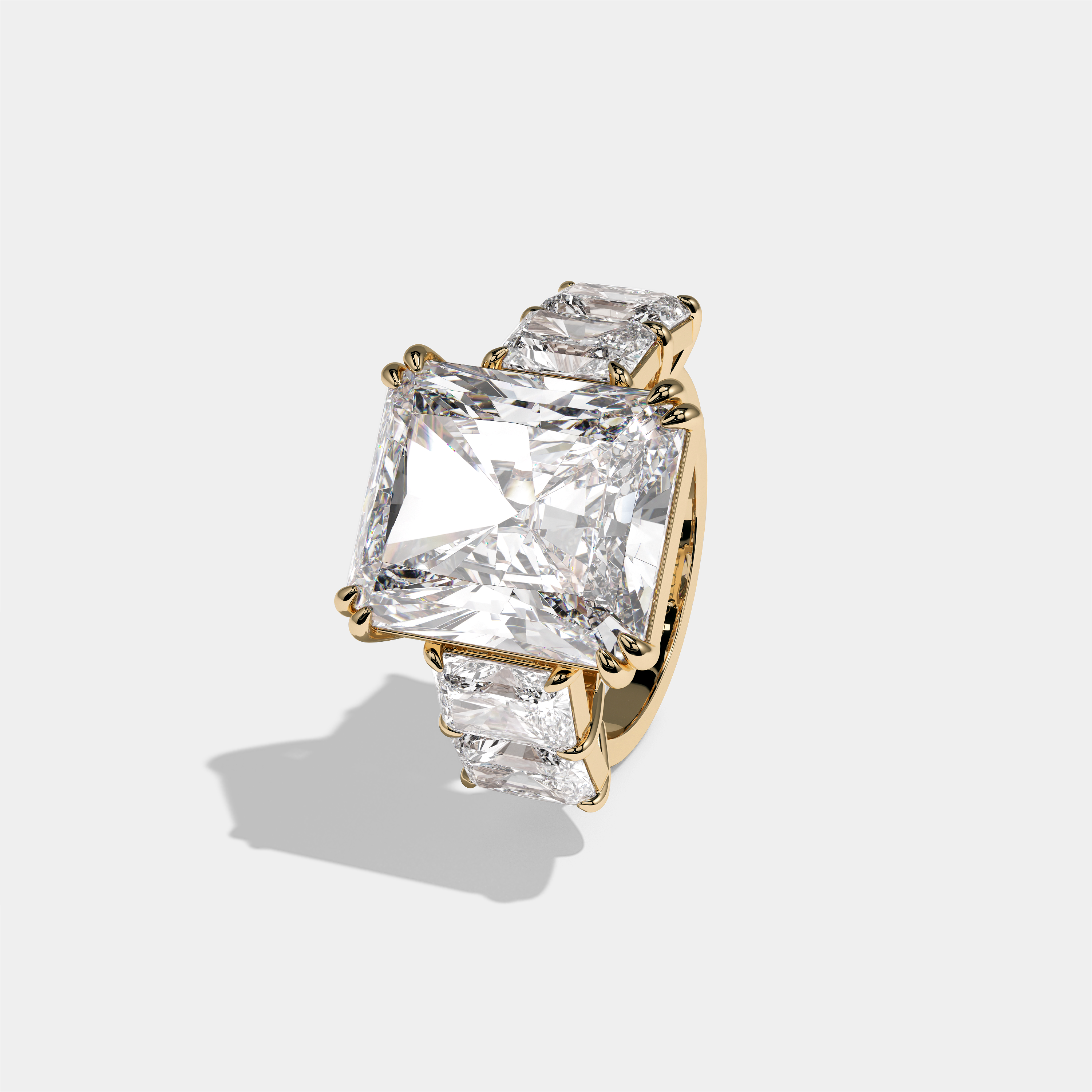 Hila Highgrove diamond radiant halo engagement ring in 18K yellow gold by Kurbãni Durjini, left view