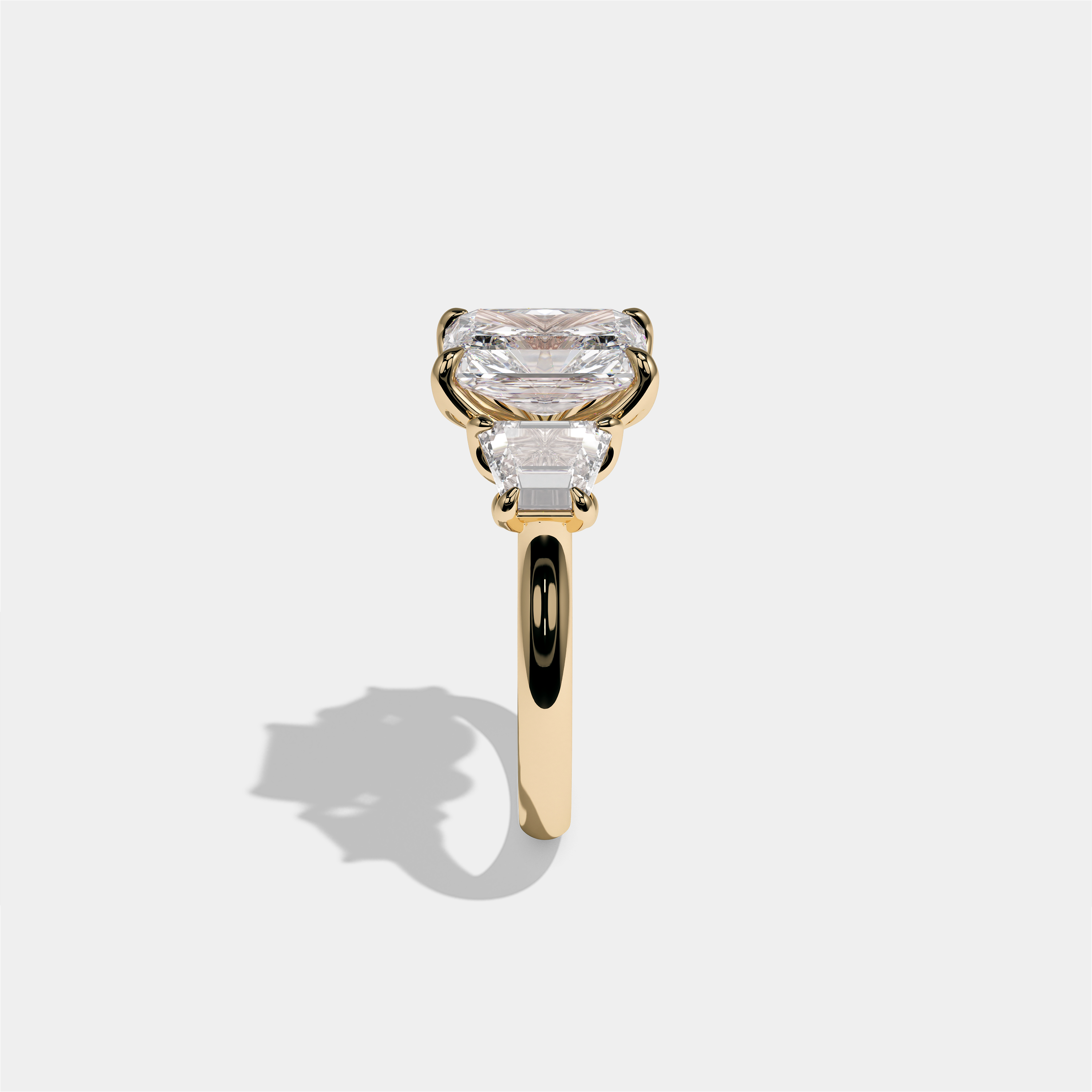 Yehudit Ashwell diamond radiant halo engagement ring in 18K yellow gold by Kurbãni Durjini, side view