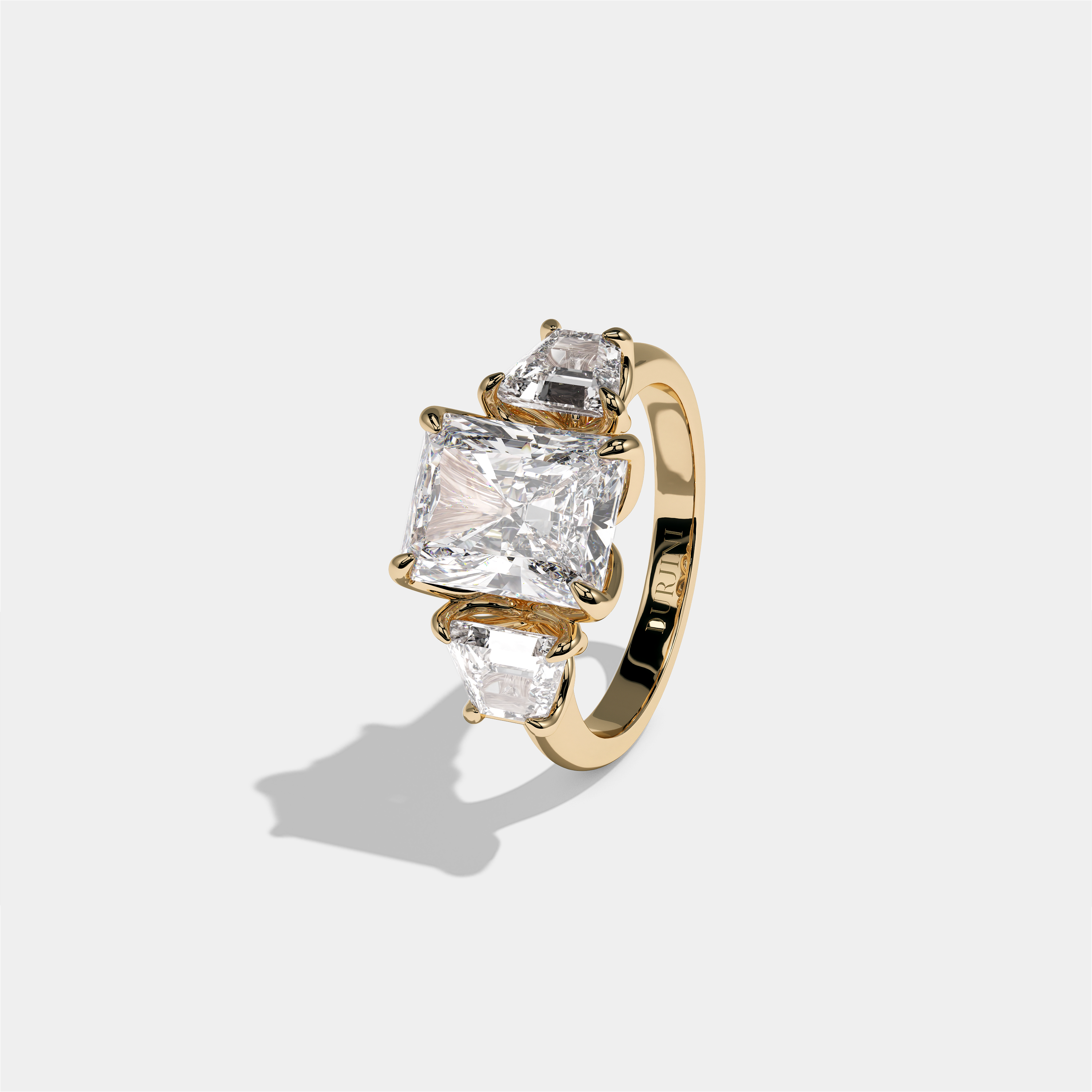 Yehudit Ashwell diamond radiant halo engagement ring in 18K yellow gold by Kurbãni Durjini, left view