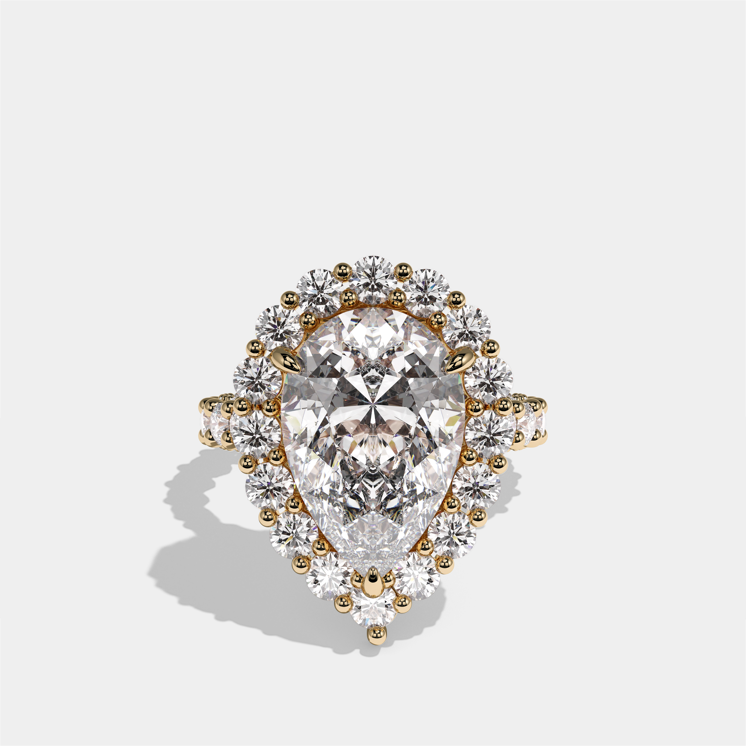 Judith Fairbourne diamond pear halo engagement ring in 18K yellow gold by Kurbãni Durjini, front view