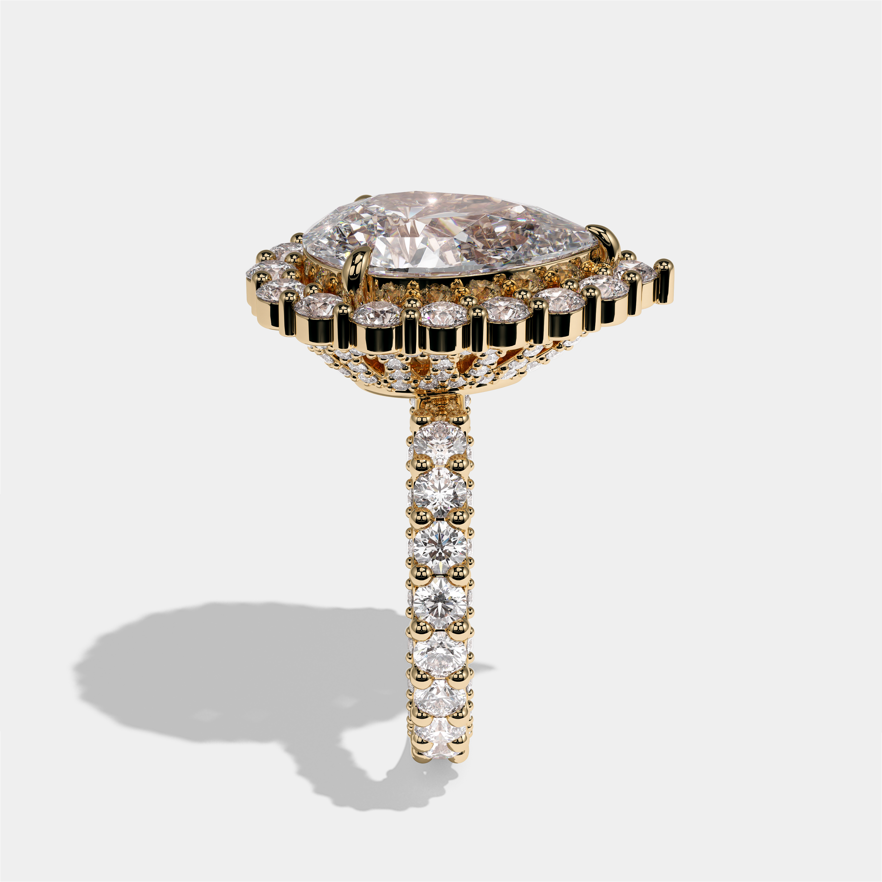 Judith Fairbourne diamond pear halo engagement ring in 18K yellow gold by Kurbãni Durjini, side view