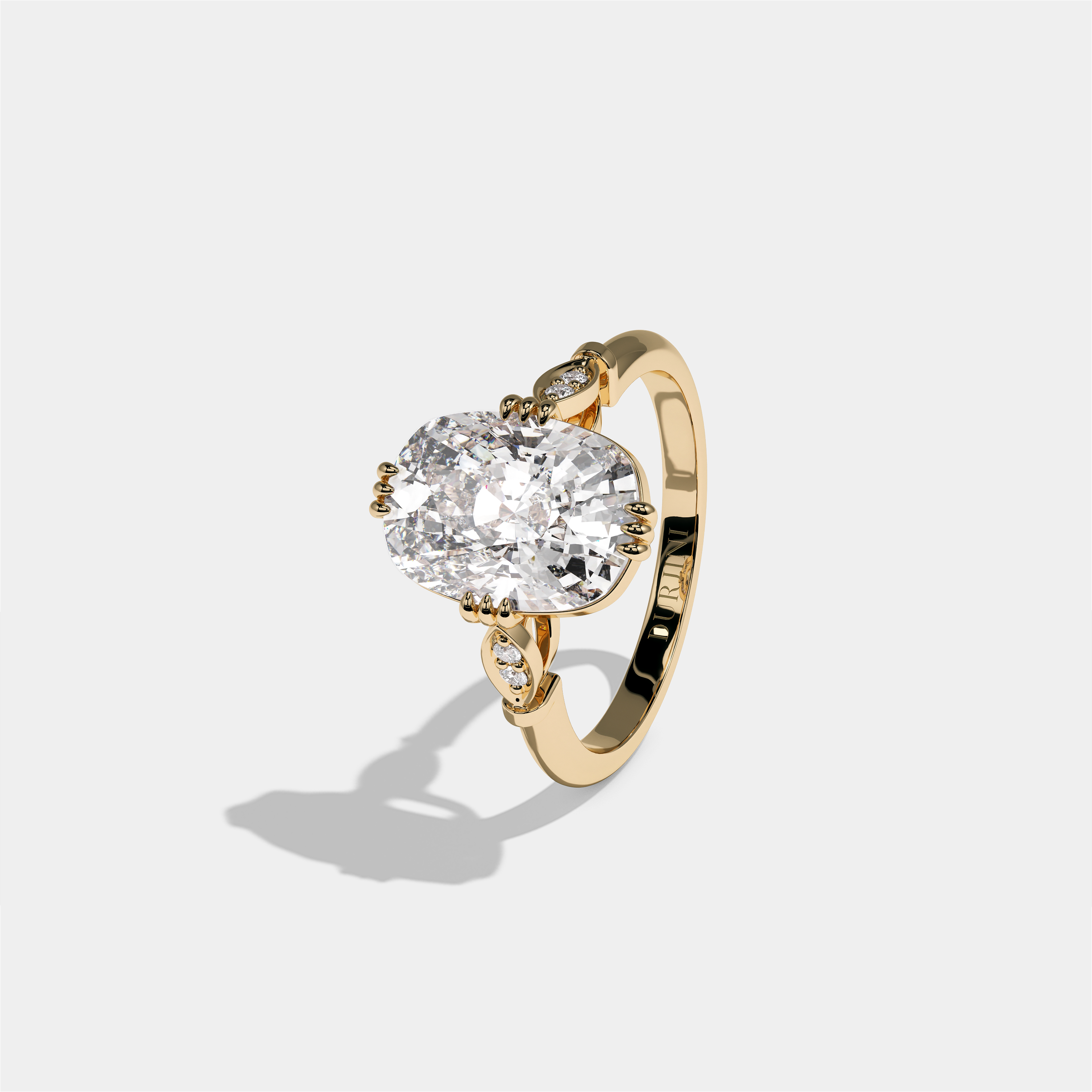 Ayala Kingsmere diamond cushion halo engagement ring in 18K yellow gold by Kurbãni Durjini, left view