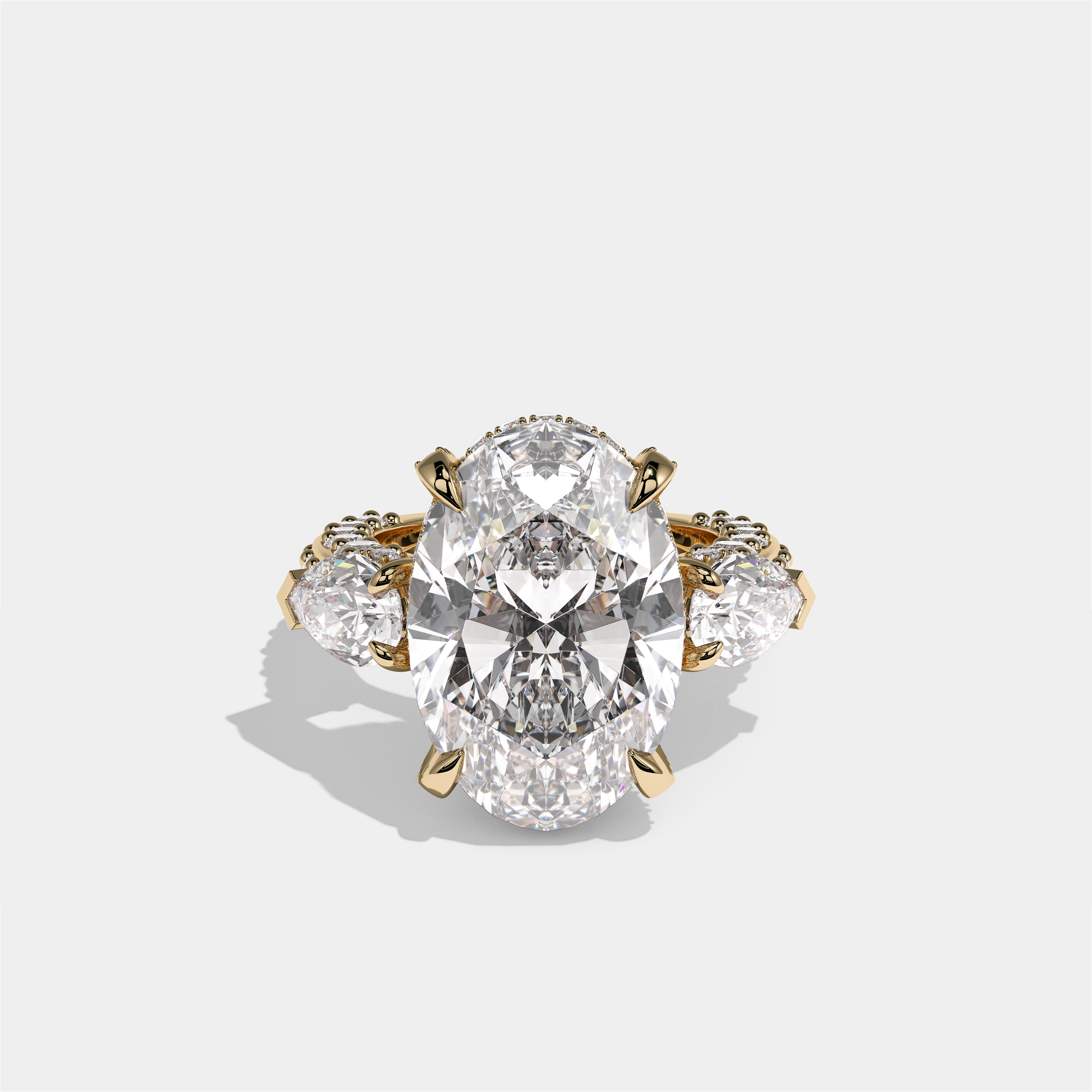 Shira Ravenscourt diamond oval halo engagement ring in 18K yellow gold by Kurbãni Durjini, front view