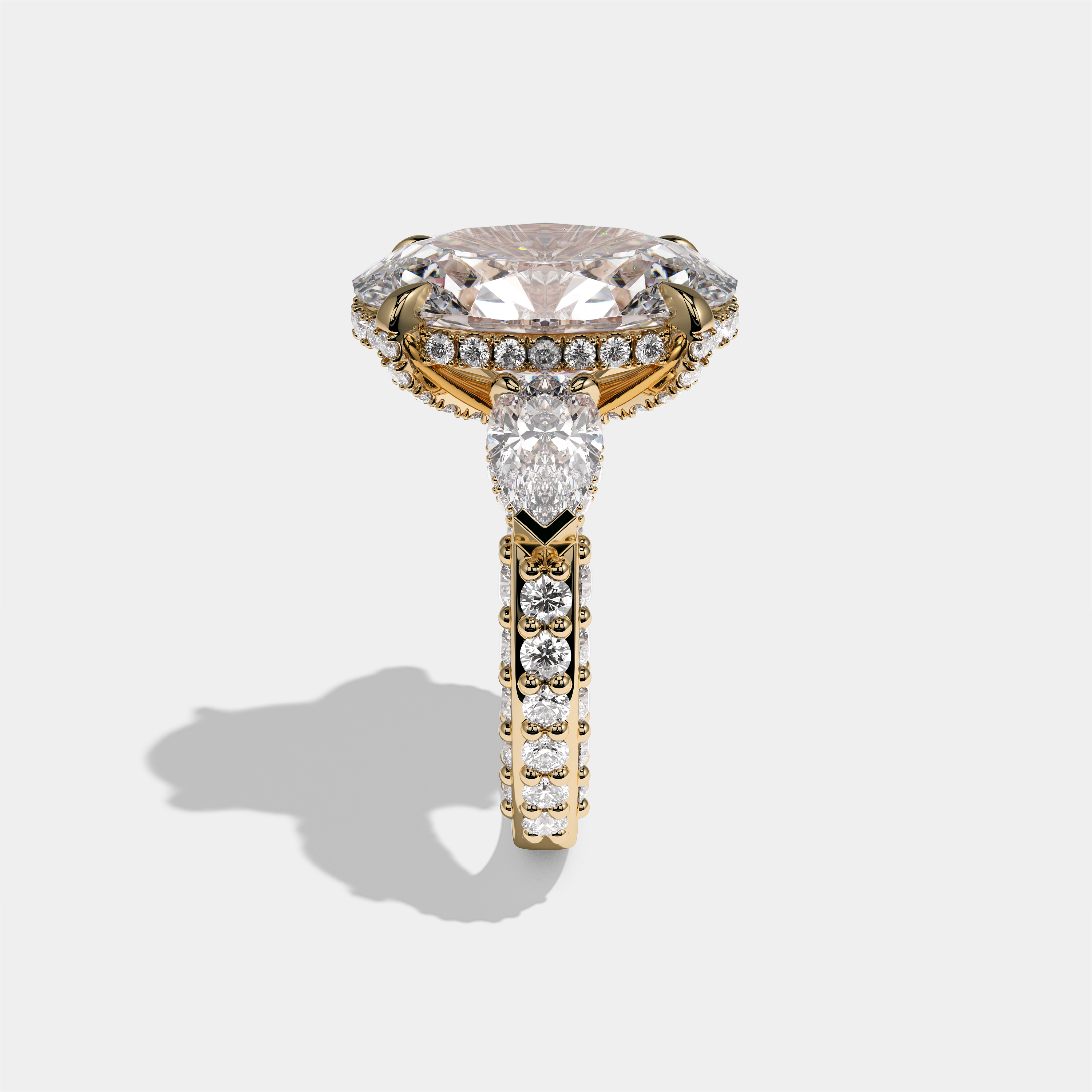 Shira Ravenscourt diamond oval halo engagement ring in 18K yellow gold by Kurbãni Durjini, side view