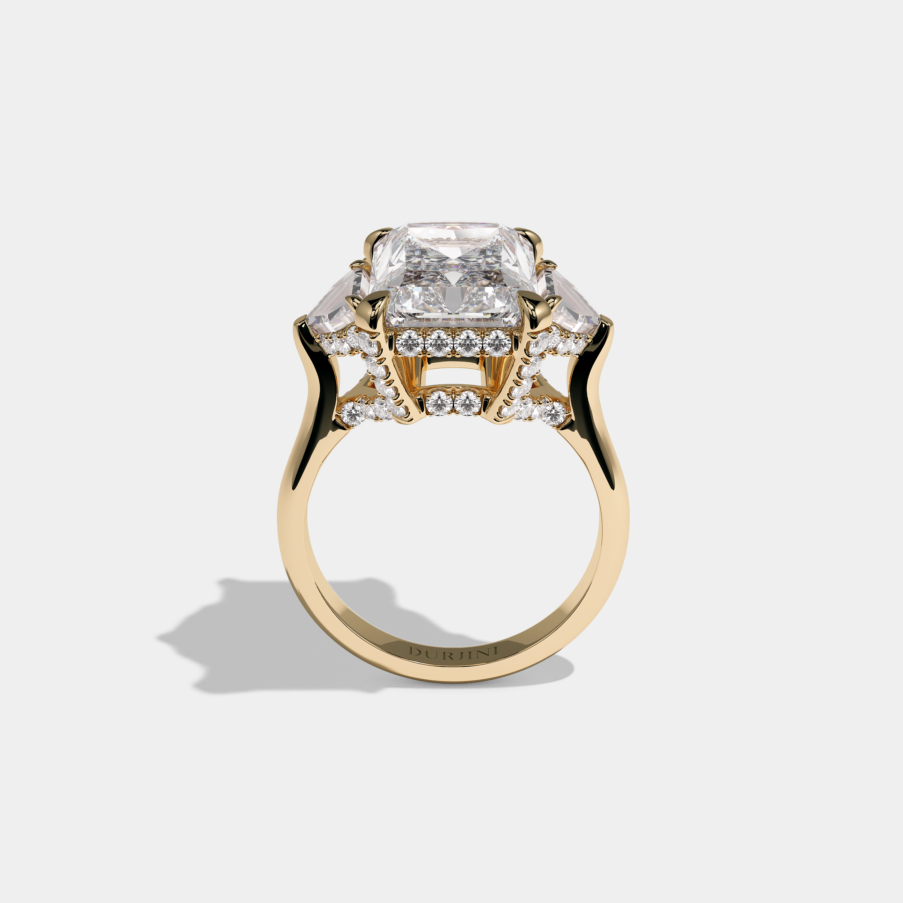 Nora Ashbourne diamond radiant halo engagement ring in 18K yellow gold by Kurbãni Durjini, full view