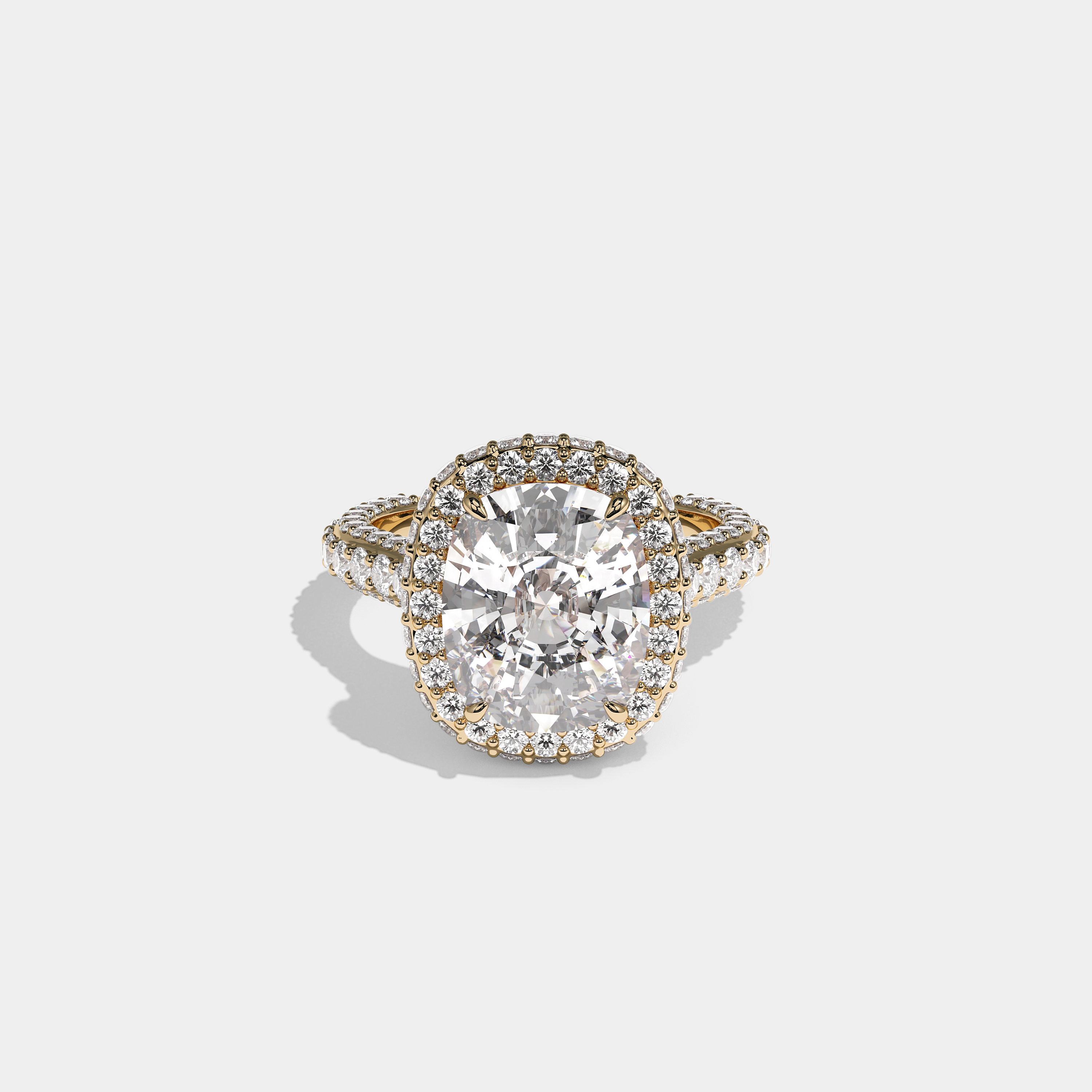 Shira Ravenscourt diamond cushion halo engagement ring in 18K yellow gold by Kurbãni Durjini, front view