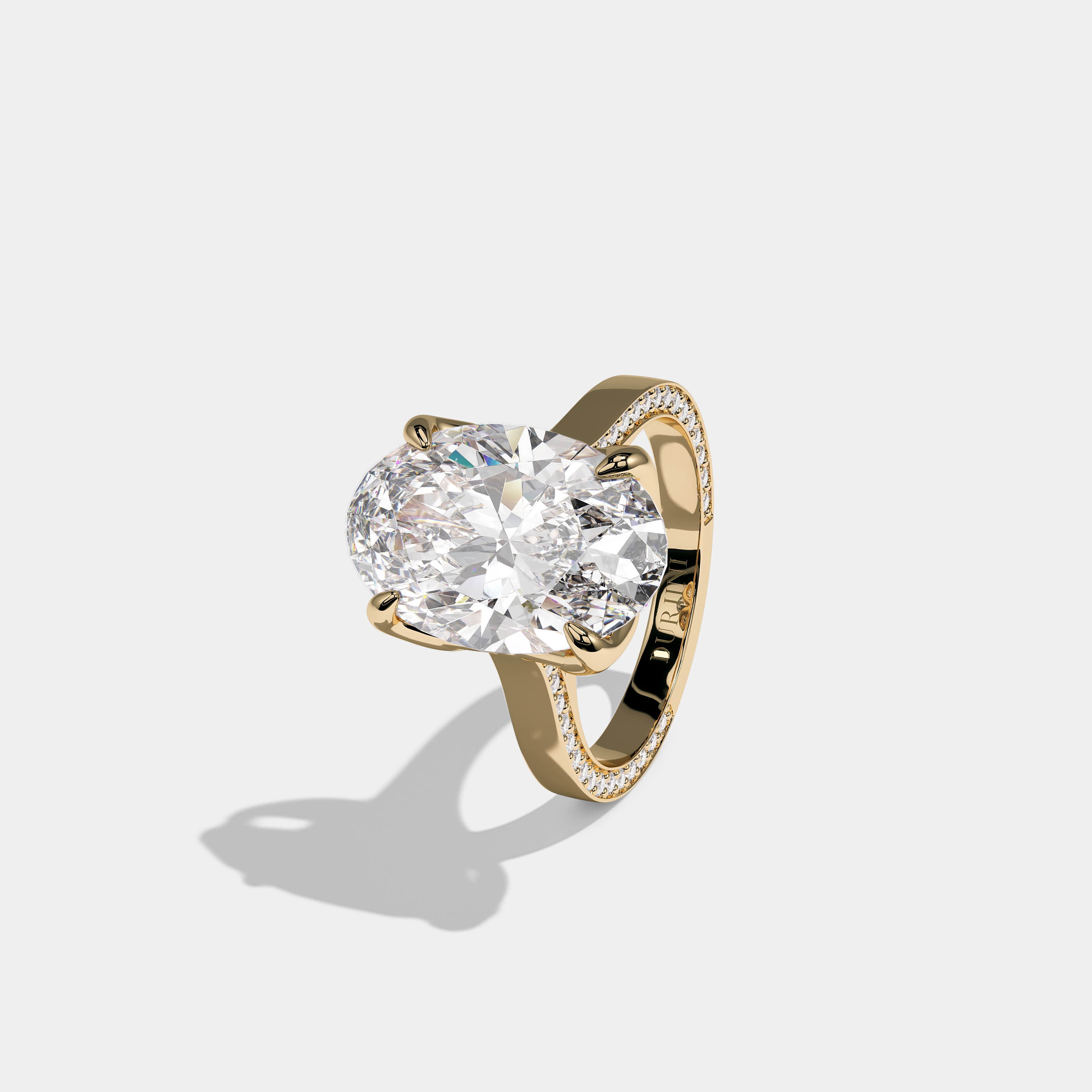 Shira Ravenscourt 10.00ct diamond oval halo engagement ring in 18K yellow gold by Kurbãni Durjini, left view