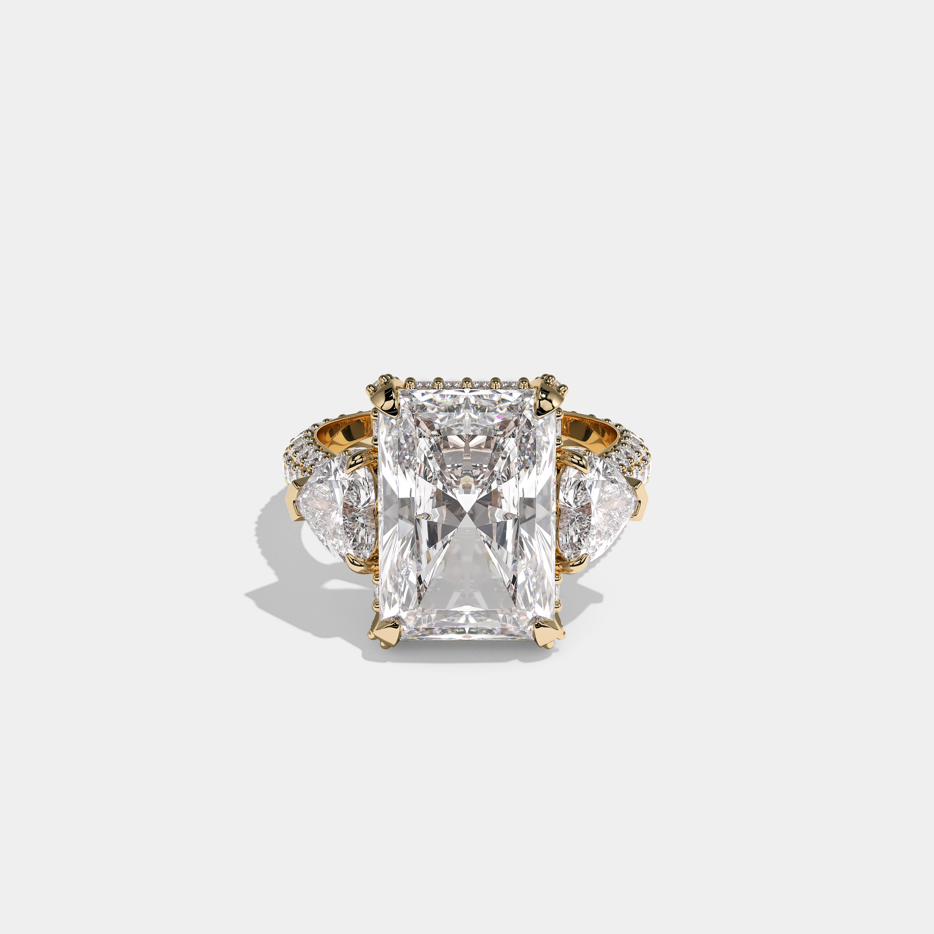 Mira Ellington 12.00ct diamond radiant halo engagement ring in 18K yellow gold by Kurbãni Durjini, front view