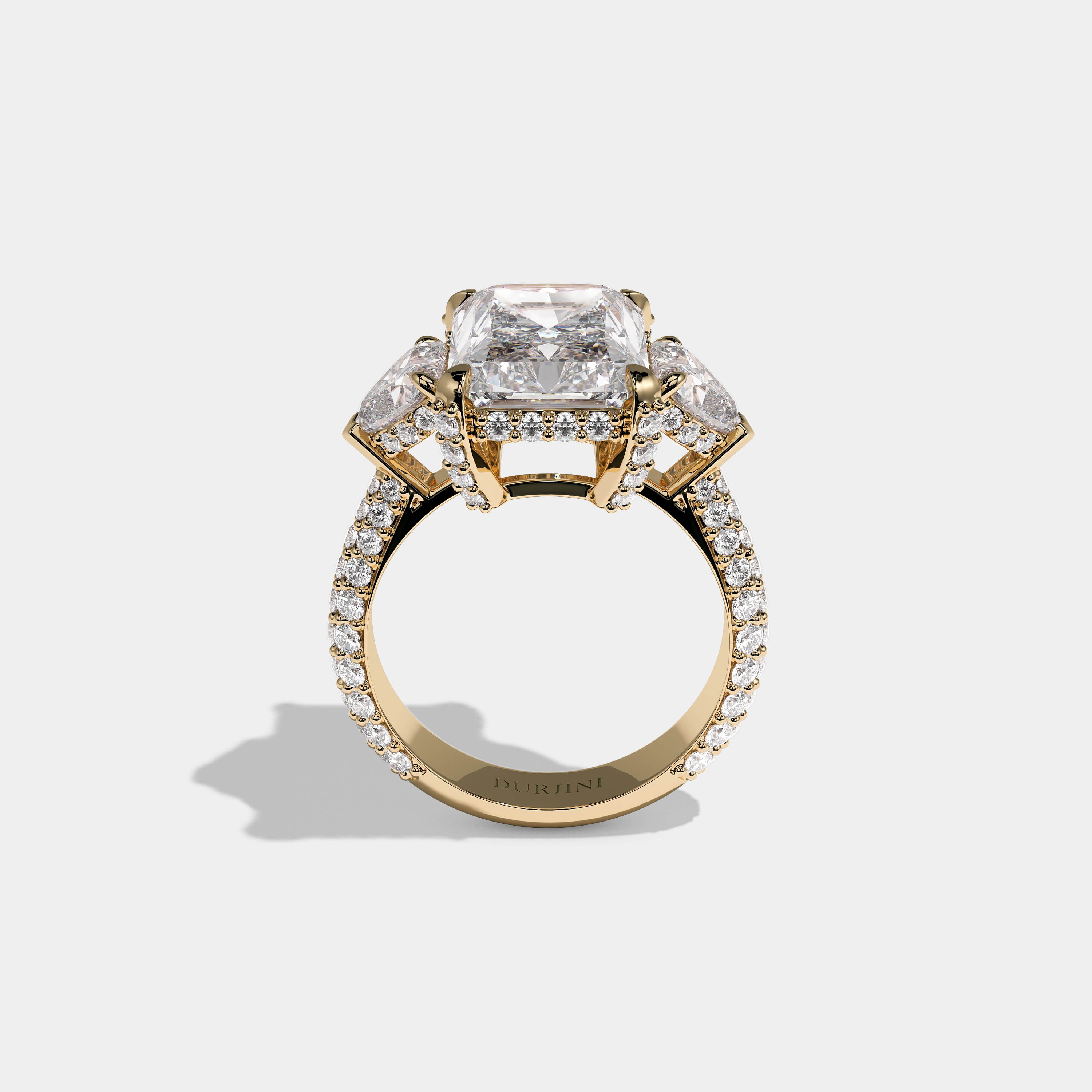 Mira Ellington 12.00ct diamond radiant halo engagement ring in 18K yellow gold by Kurbãni Durjini, full view
