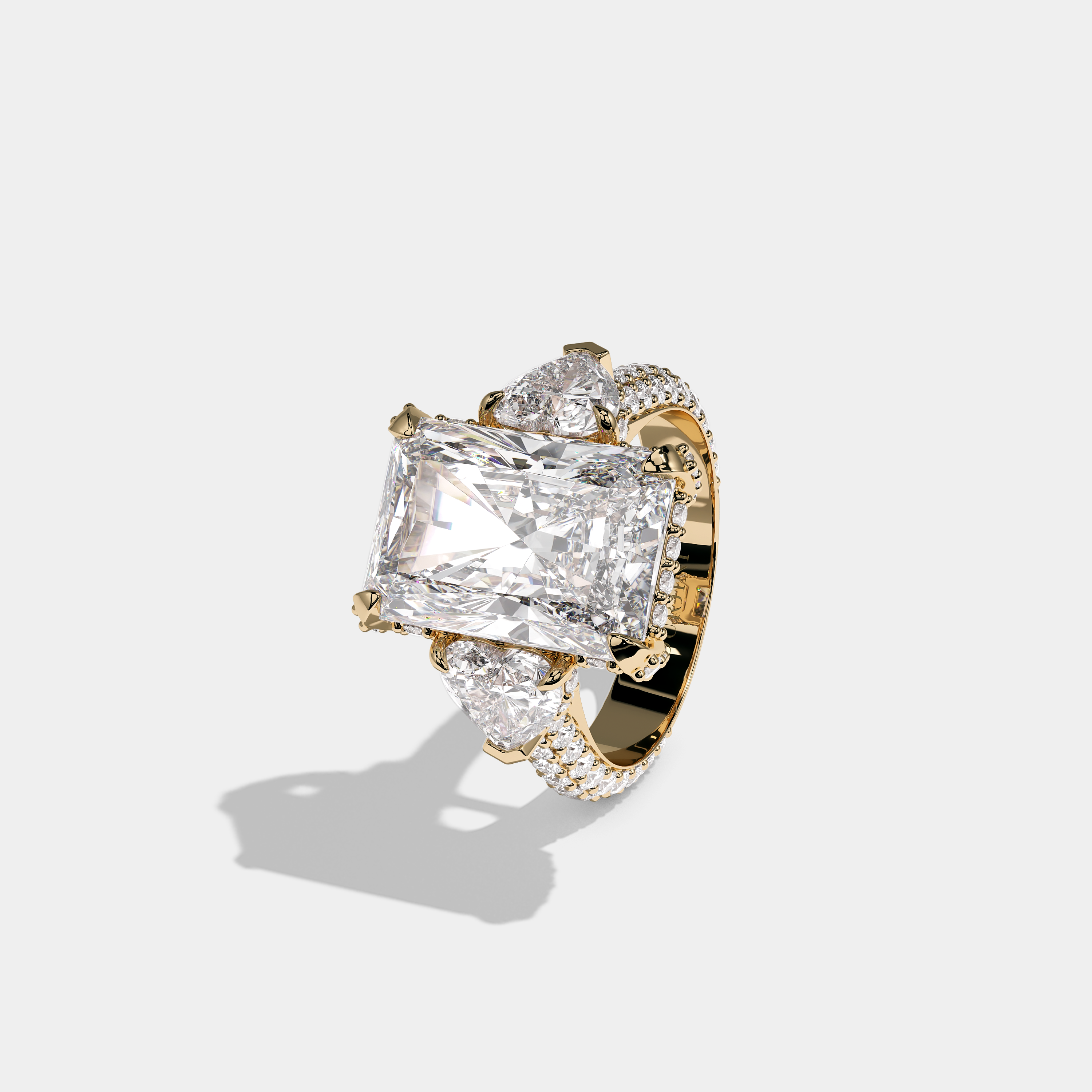 Mira Ellington 12.00ct diamond radiant halo engagement ring in 18K yellow gold by Kurbãni Durjini, left view