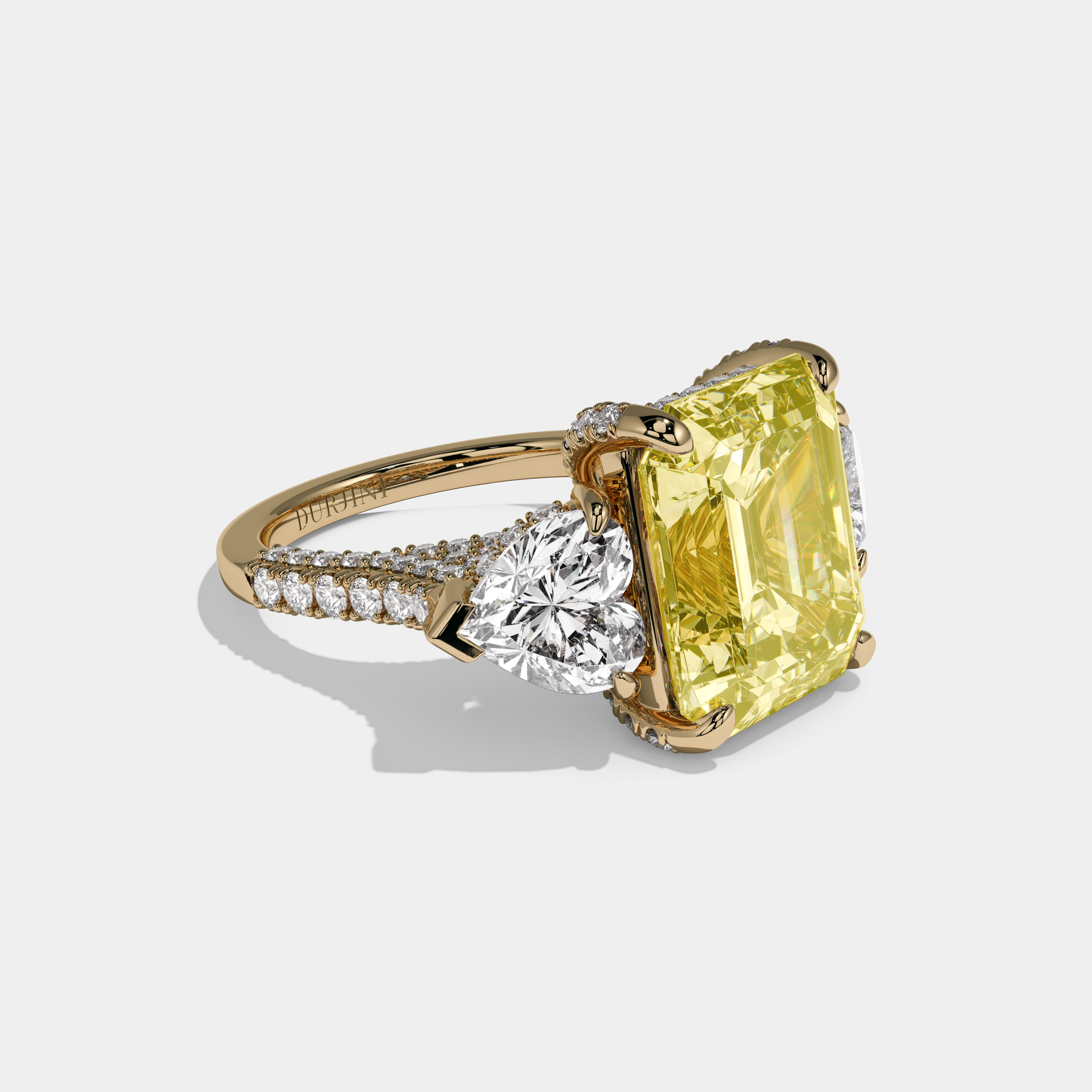 Elizabeth Fancy Yellow Emerald Cut Diamond Halo With Twin Heart Sides Engagement Ring 10ct 18K Yellow Gold