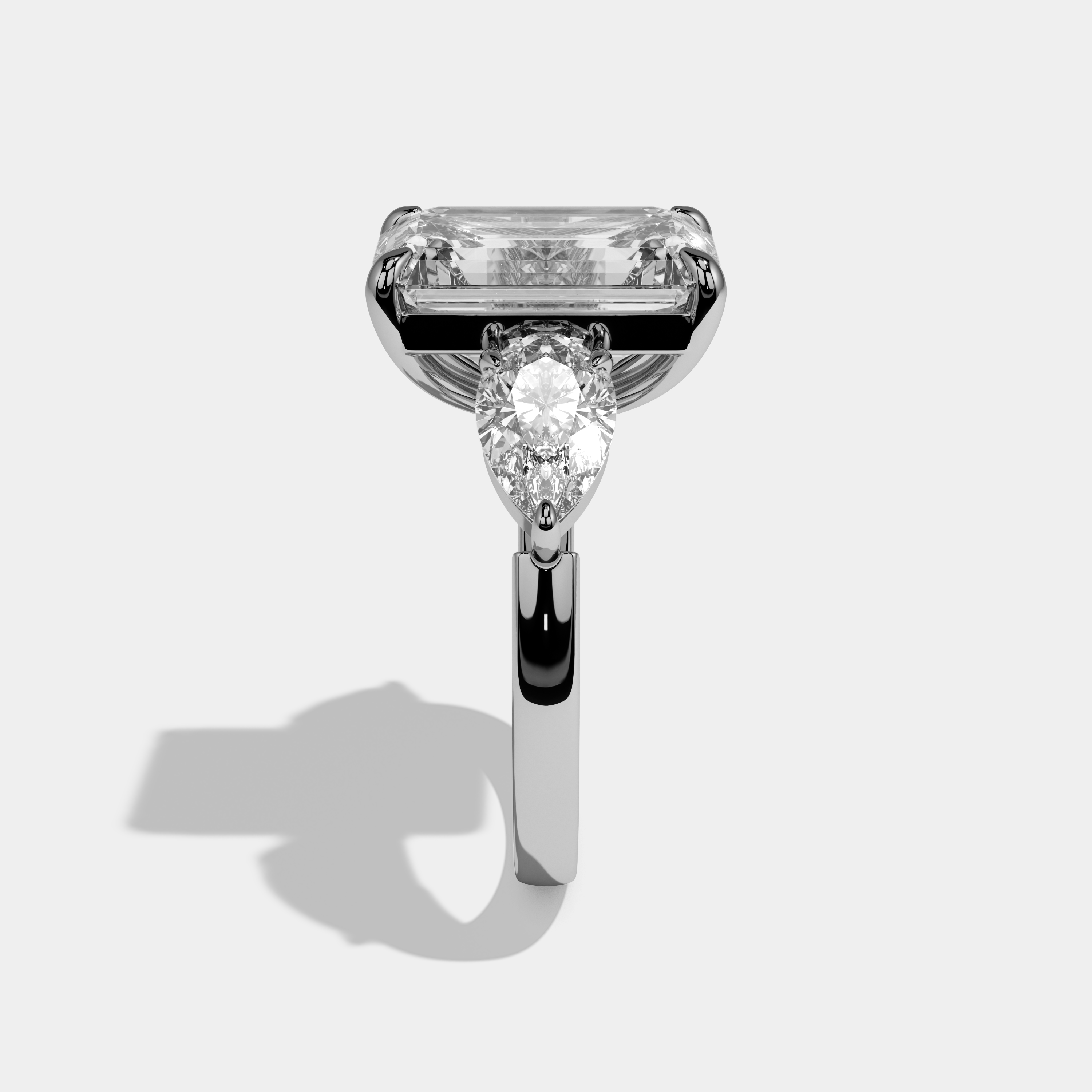 Amelia Emerald Cut Diamond Plain Band With Pear Sides Engagement Ring 10ct 18k White Gold