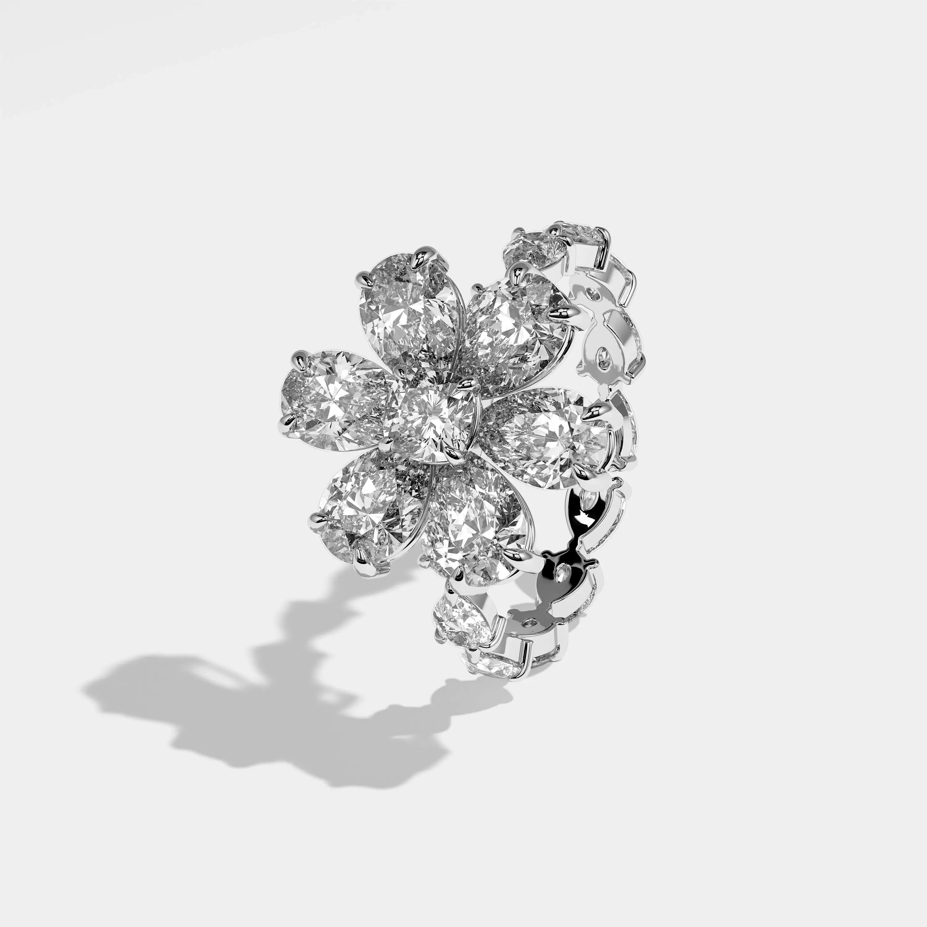 Harmony pear flower halo diamond engagement ring in 18K white gold by Kurbãni Durjini, left view