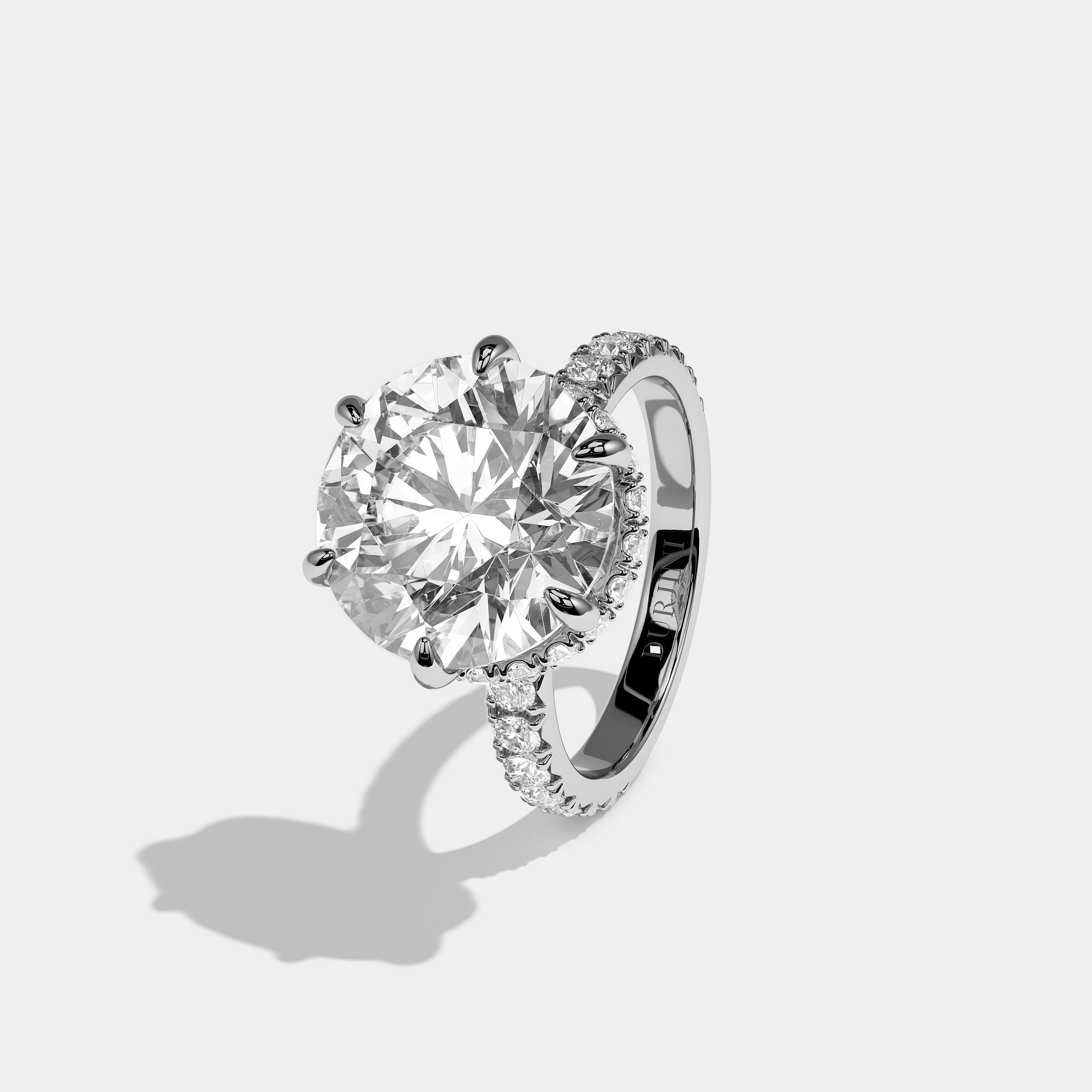 Left View – Kurbãni Durjini Corvane Éclat Diamond Round Brilliant Halo Engagement Ring