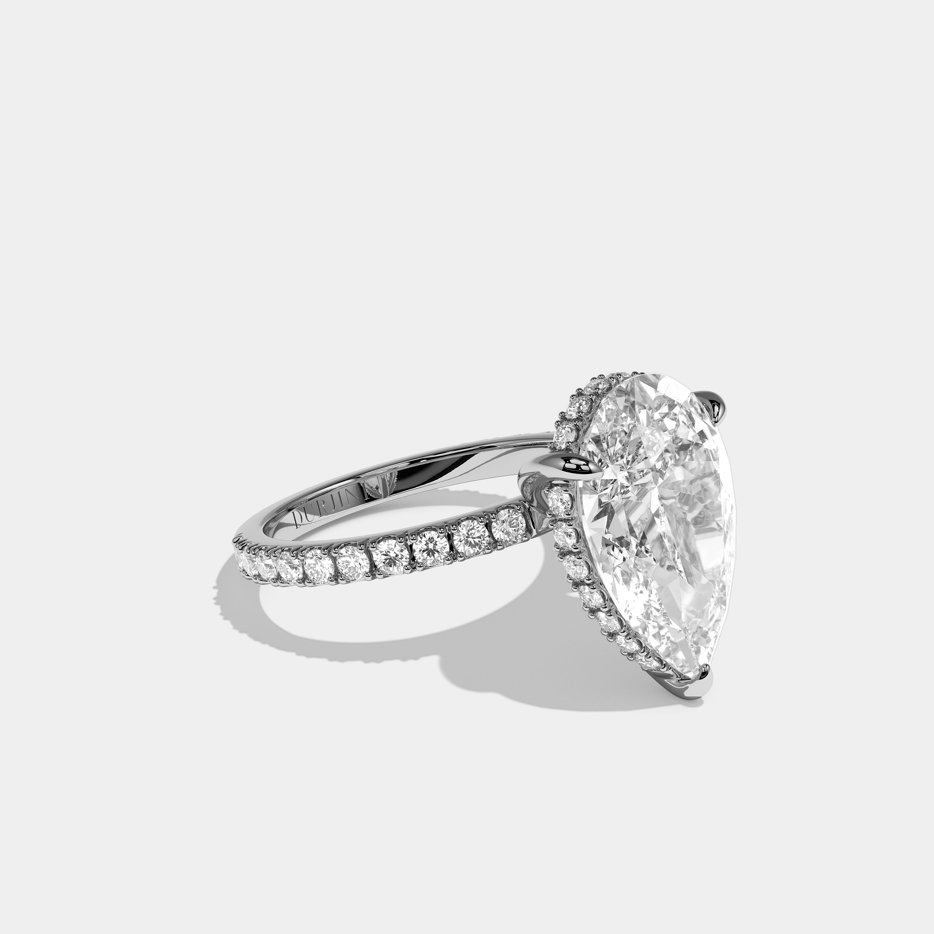 Right view Aurisse Éclat Diamond Pear Halo Engagement Ring White Gold Kurbãni Durjini