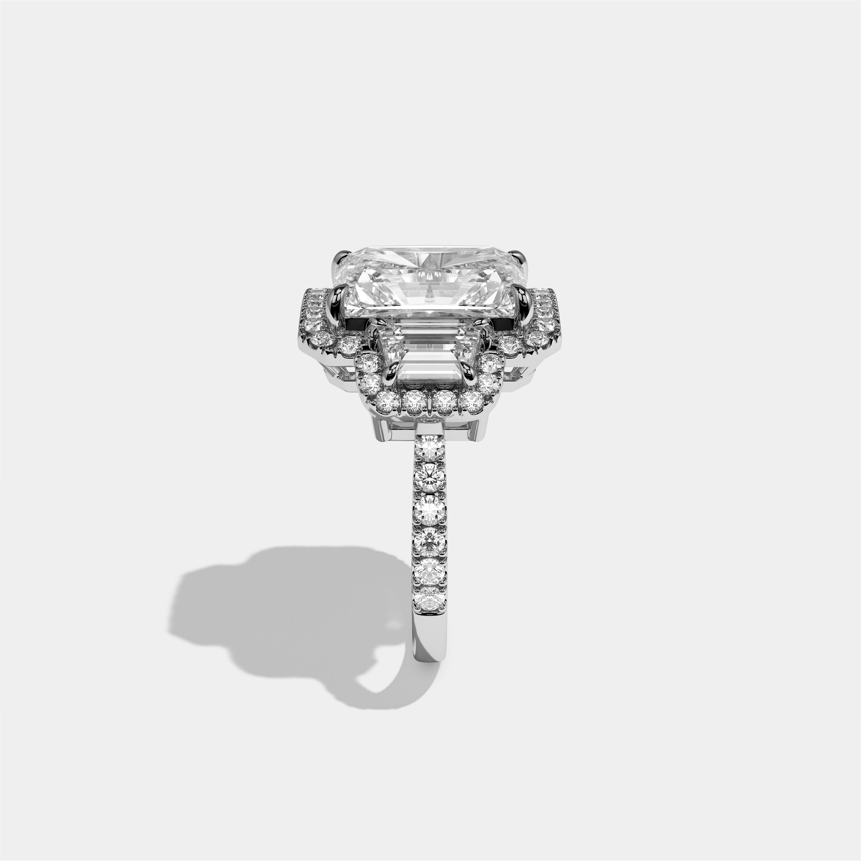 Constance Eclat radiant halo diamond engagement ring in 18K white gold by Kurbãni Durjini, side view