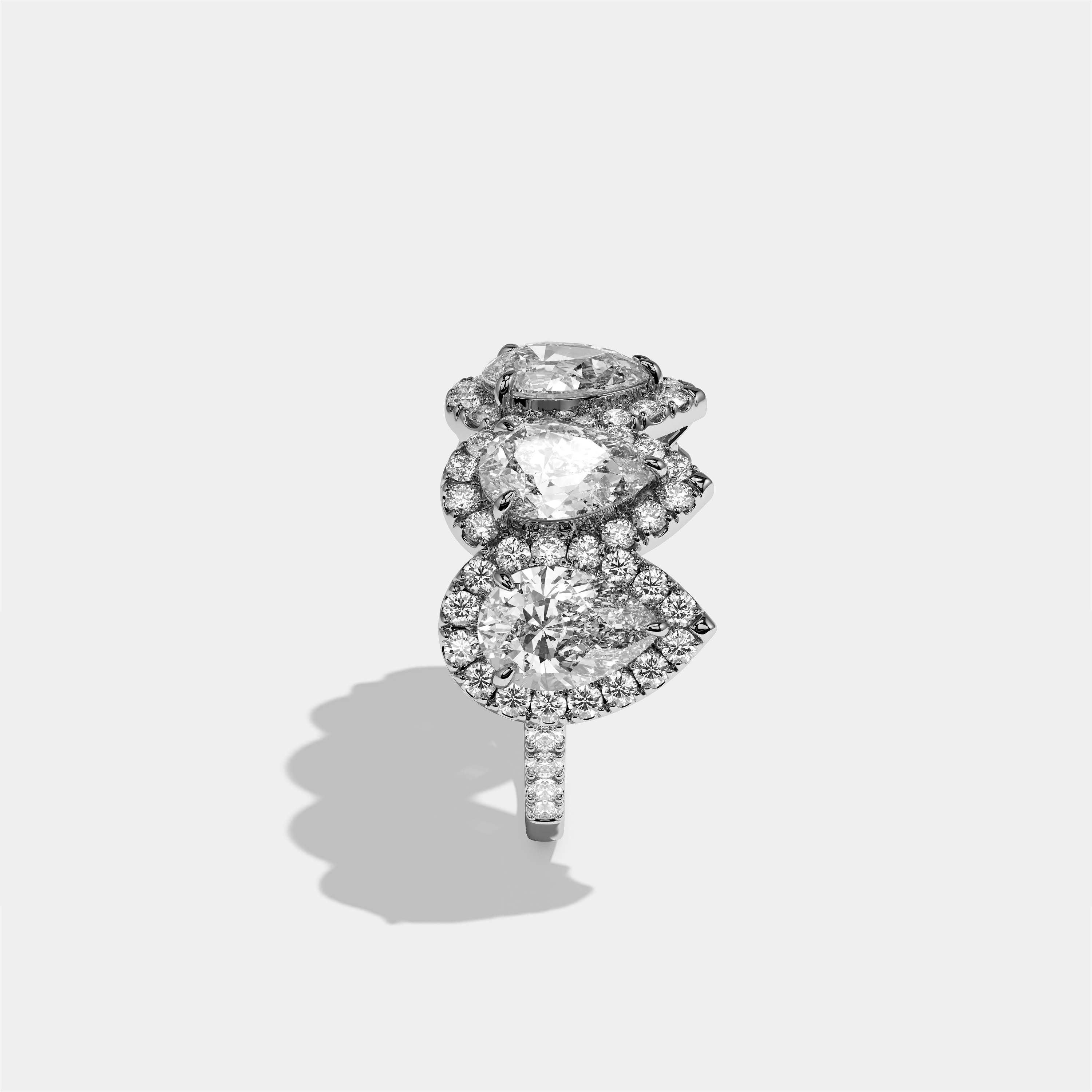 Maud Elan pear halo diamond engagement ring in 18K white gold by Kurbãni Durjini, side view