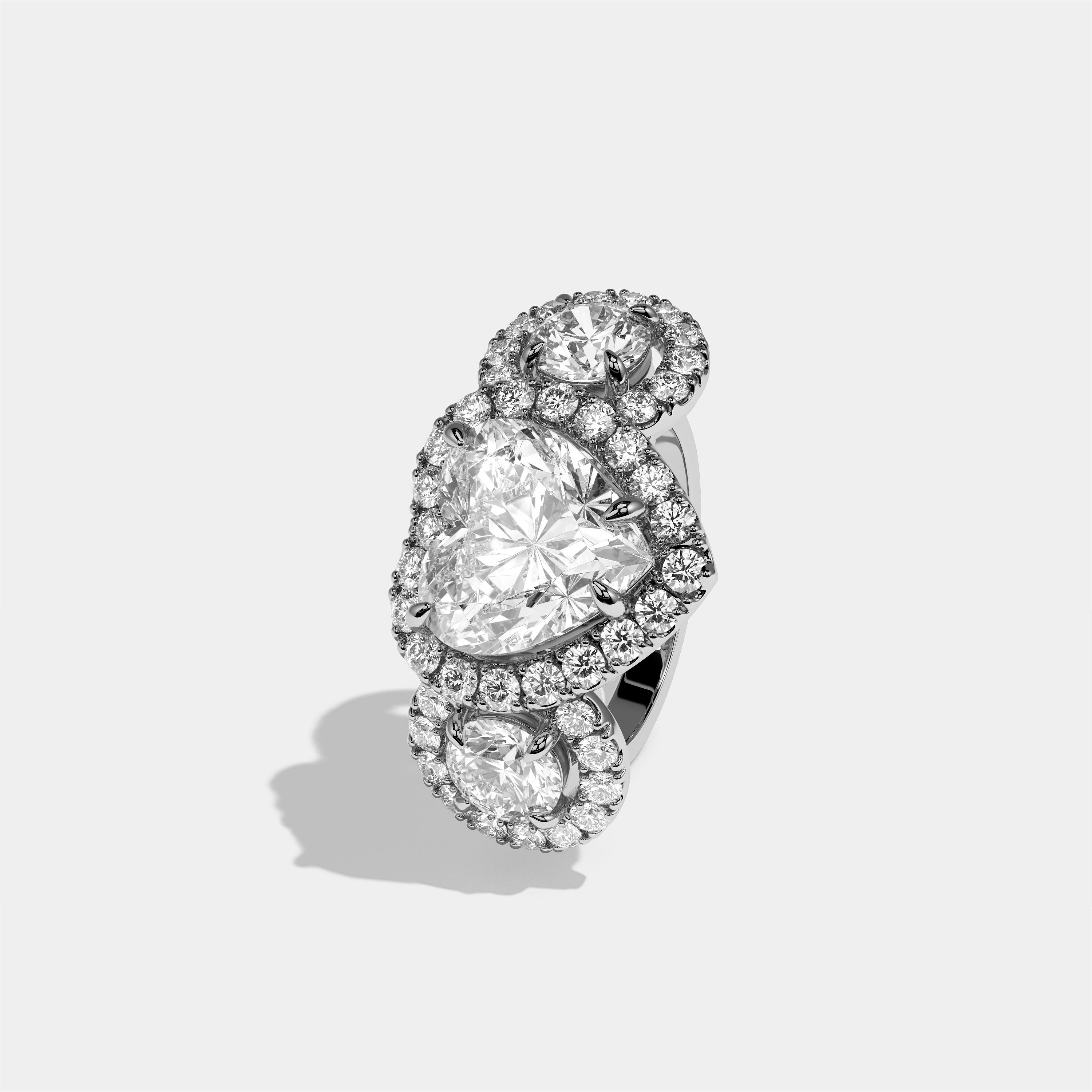 Blanche Amour heart halo diamond engagement ring in 18K white gold by Kurbãni Durjini, left view