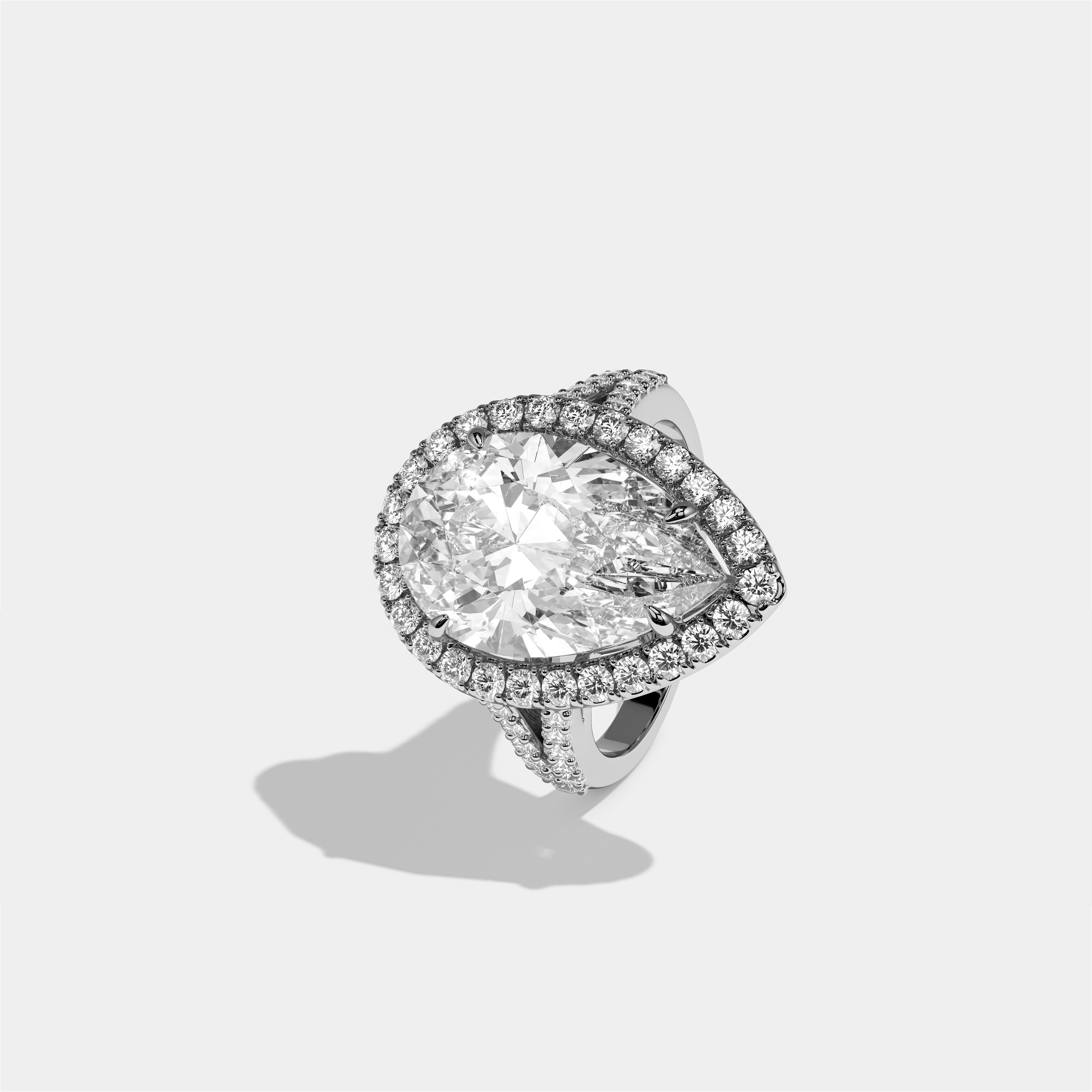 Helena diamond pear halo engagement ring in 18K white gold by Kurbãni Durjini, left view