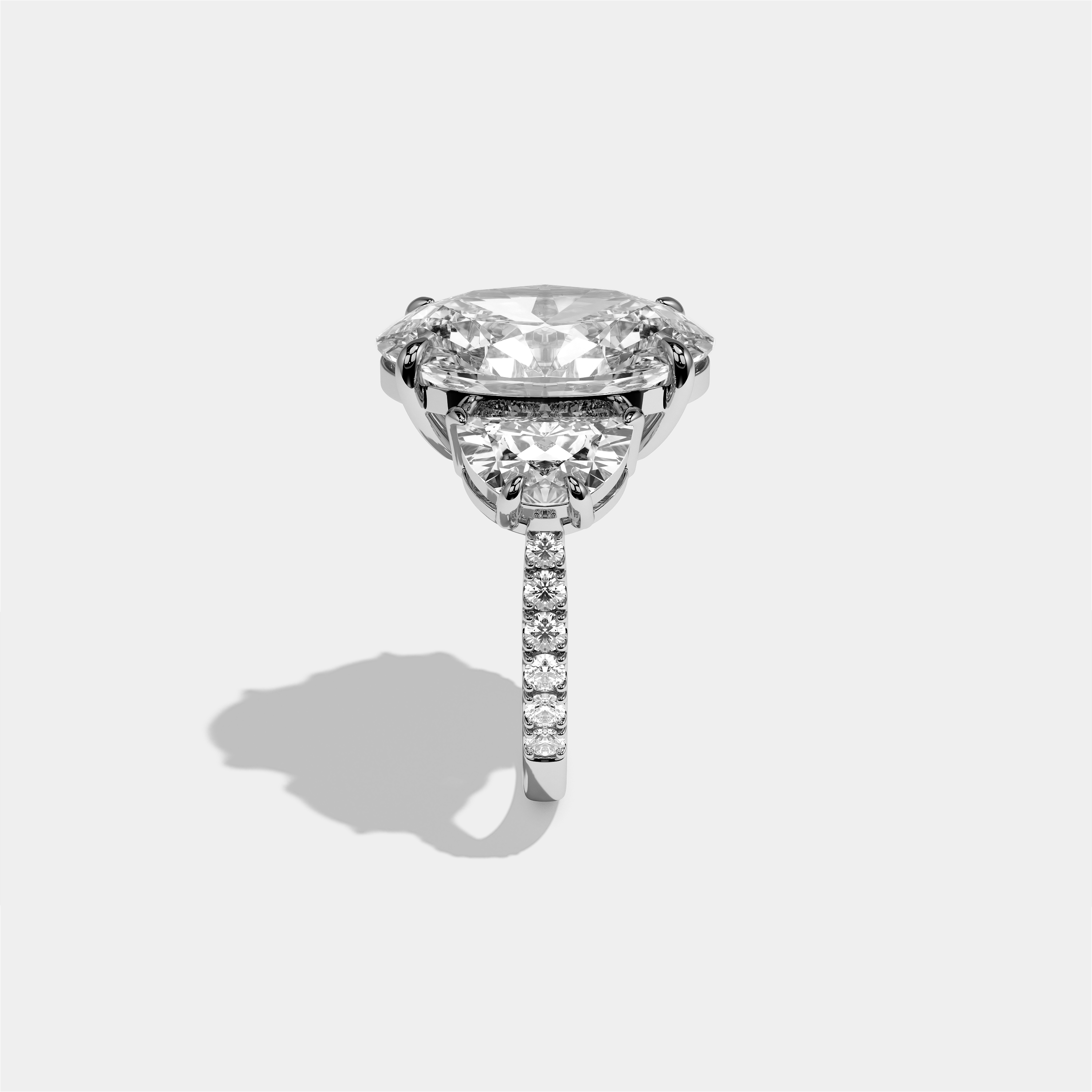 Philippa Agnes diamond oval halo engagement ring in 18K white gold by Kurbãni Durjini, side view