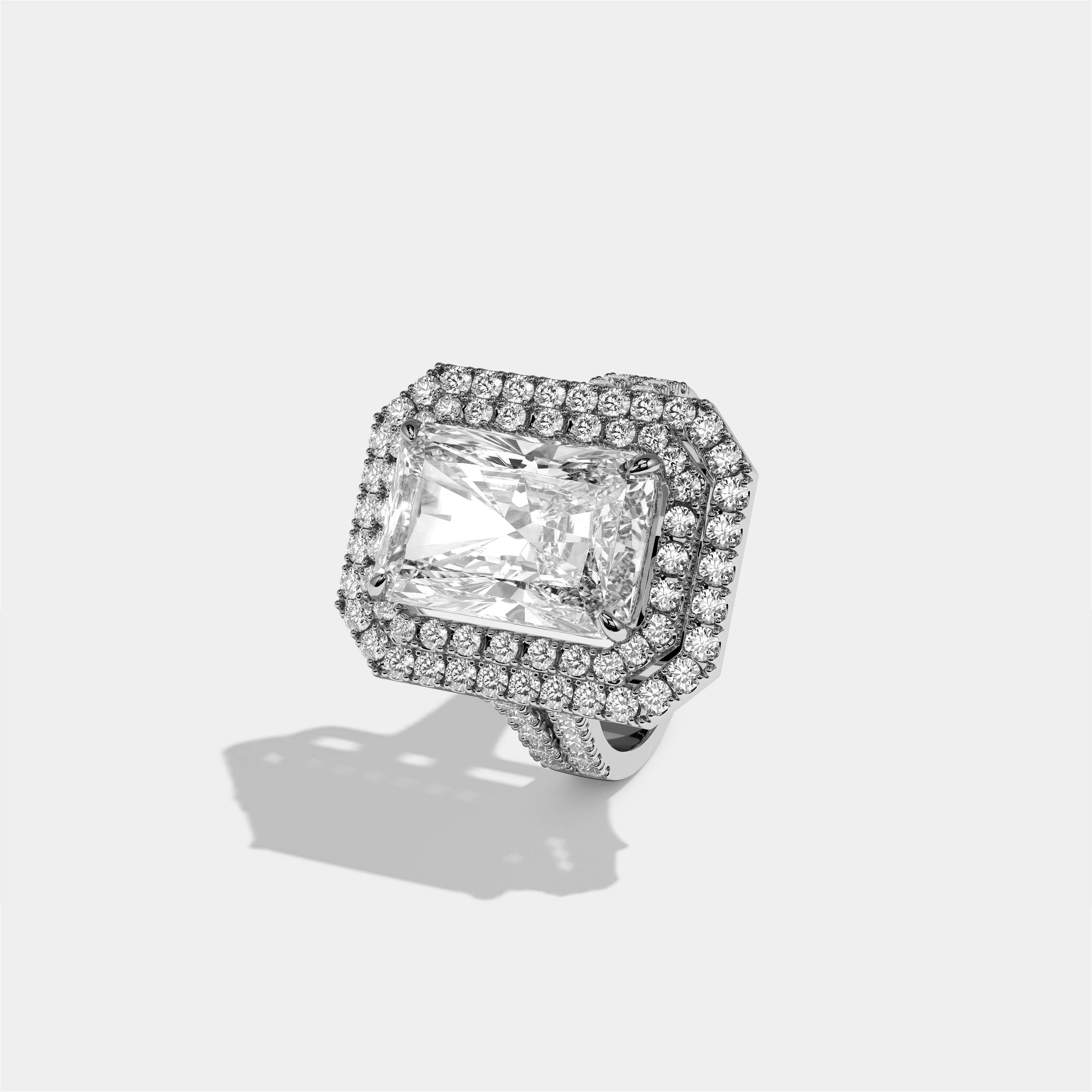 Cecilia Eleanor diamond radiant halo engagement ring in 18K white gold by Kurbãni Durjini, left view