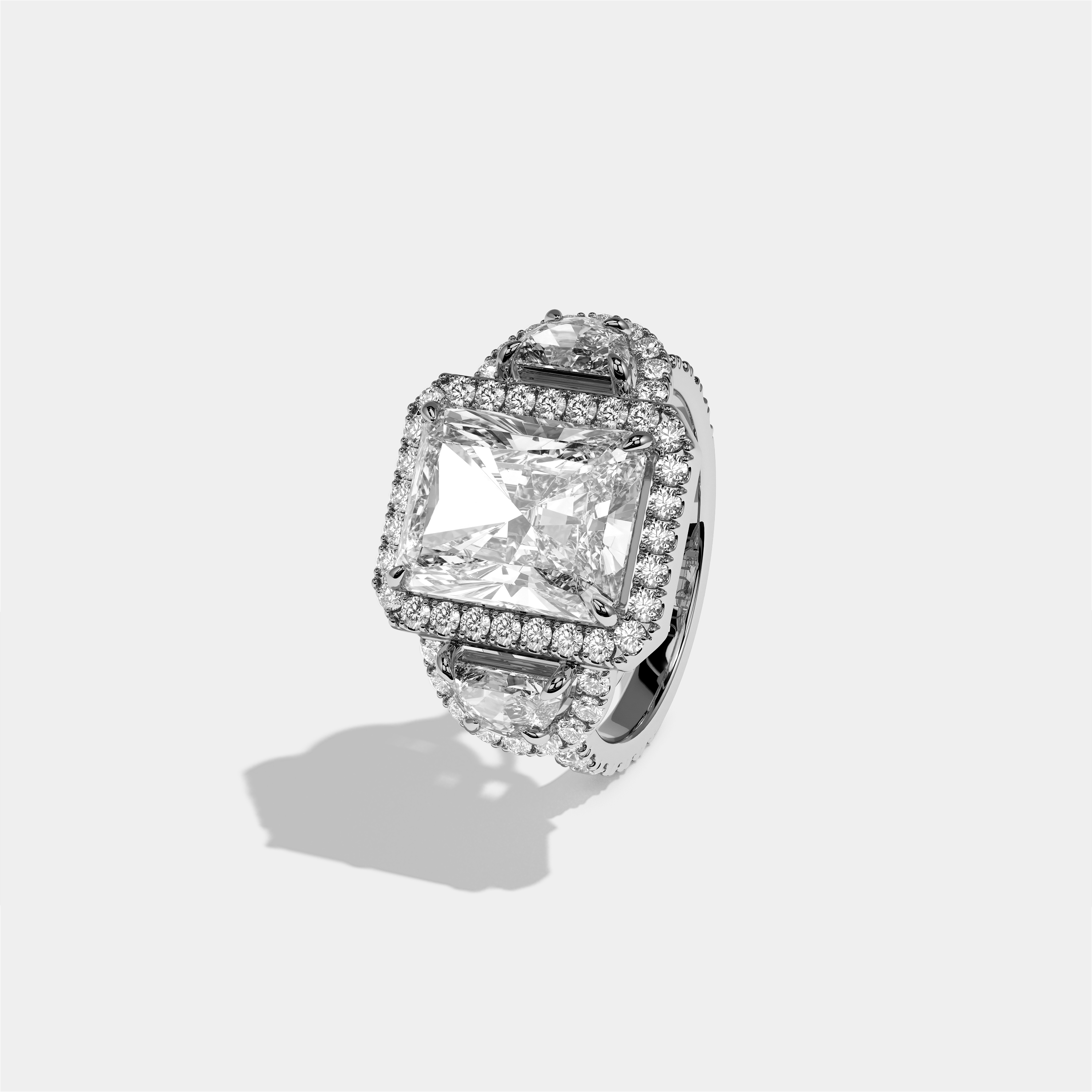 Aveline Godiva diamond radiant halo engagement ring in 18K white gold by Kurbãni Durjini, left view