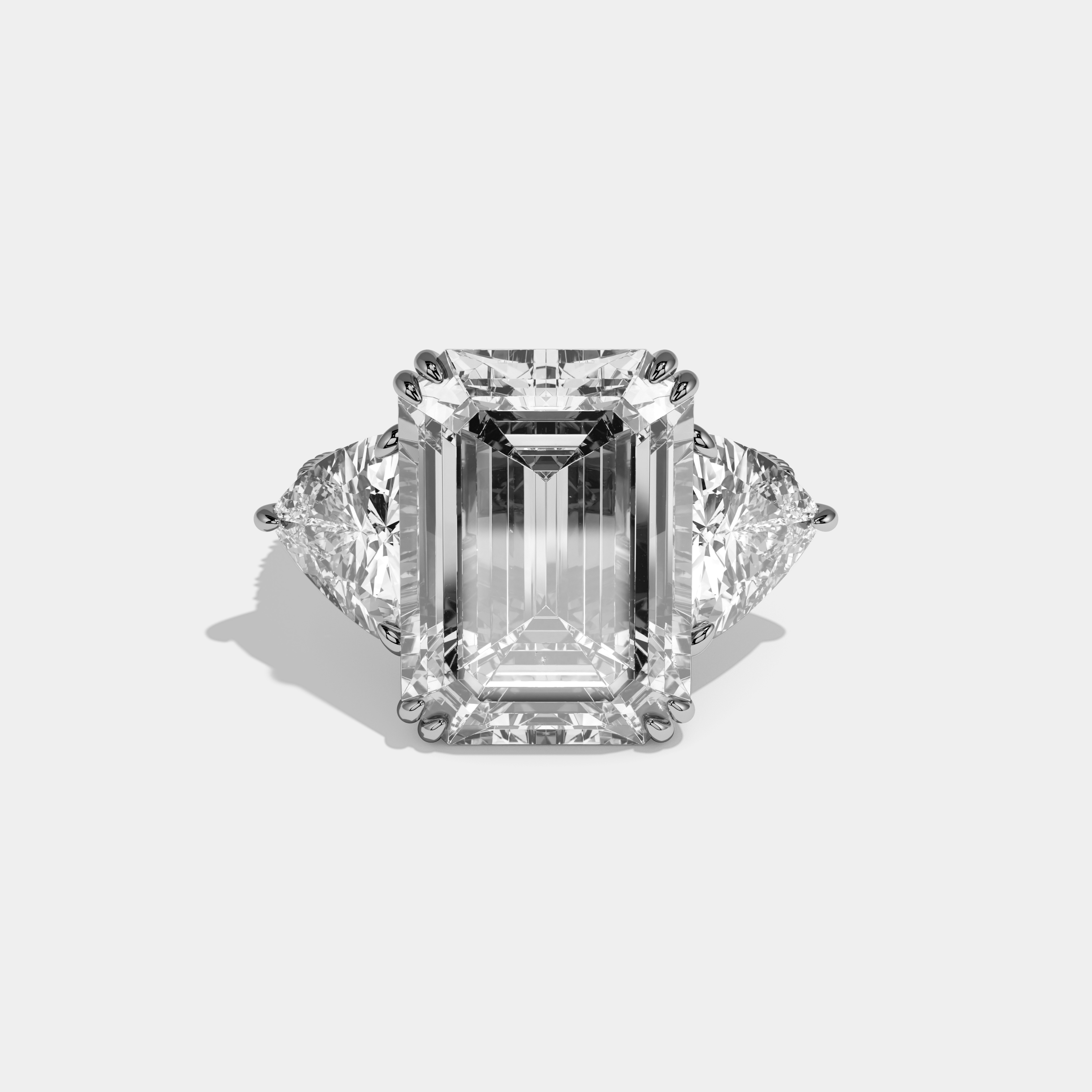 Vionnet Emerald Cut Diamond Halo Engagement Ring With Twin Trillion Cut Sides 10ct 18k White Gold