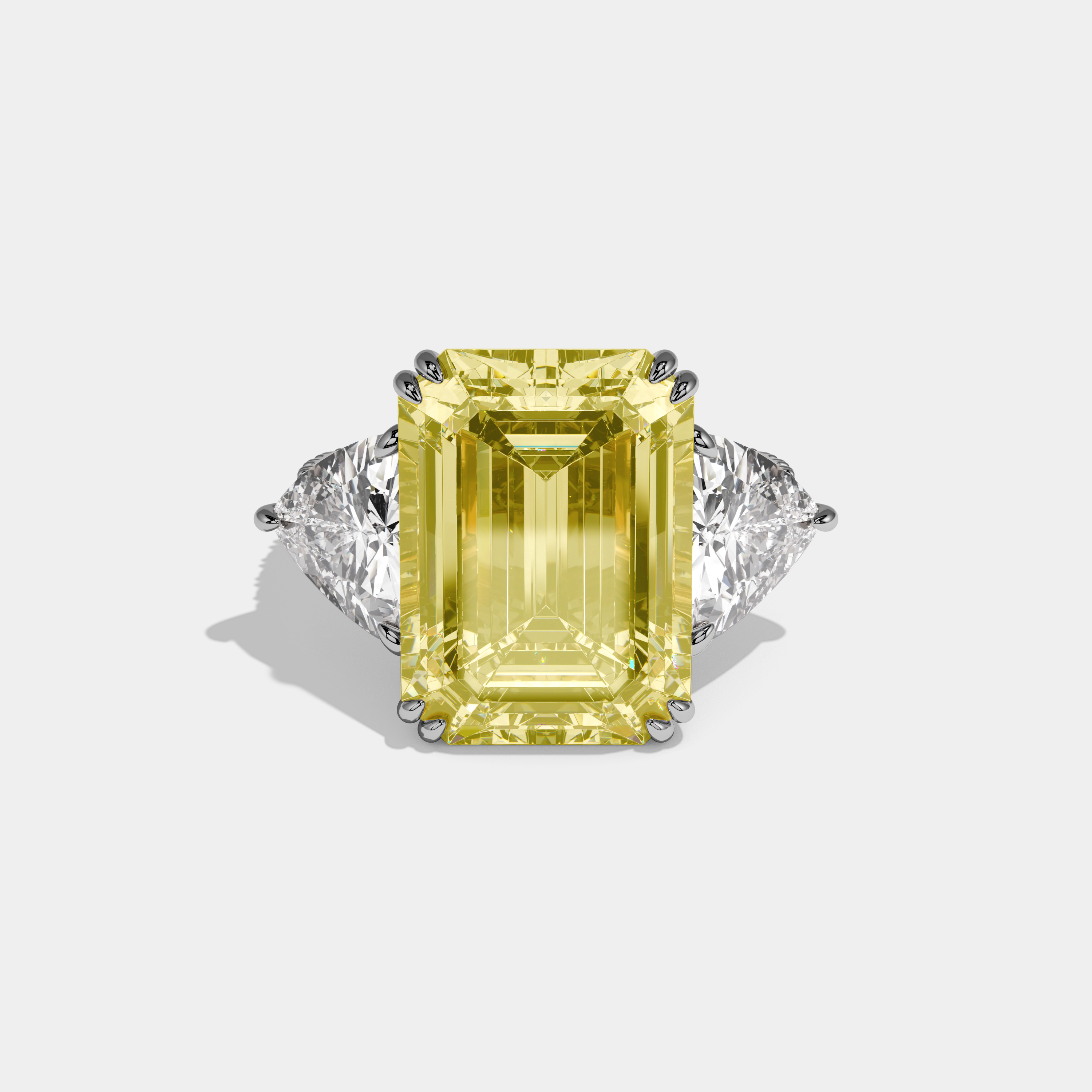 Vionnet Fancy Yellow Emerald Cut Diamond Halo Engagement Ring With Twin Trillion Cut Sides 10ct 18K White Gold