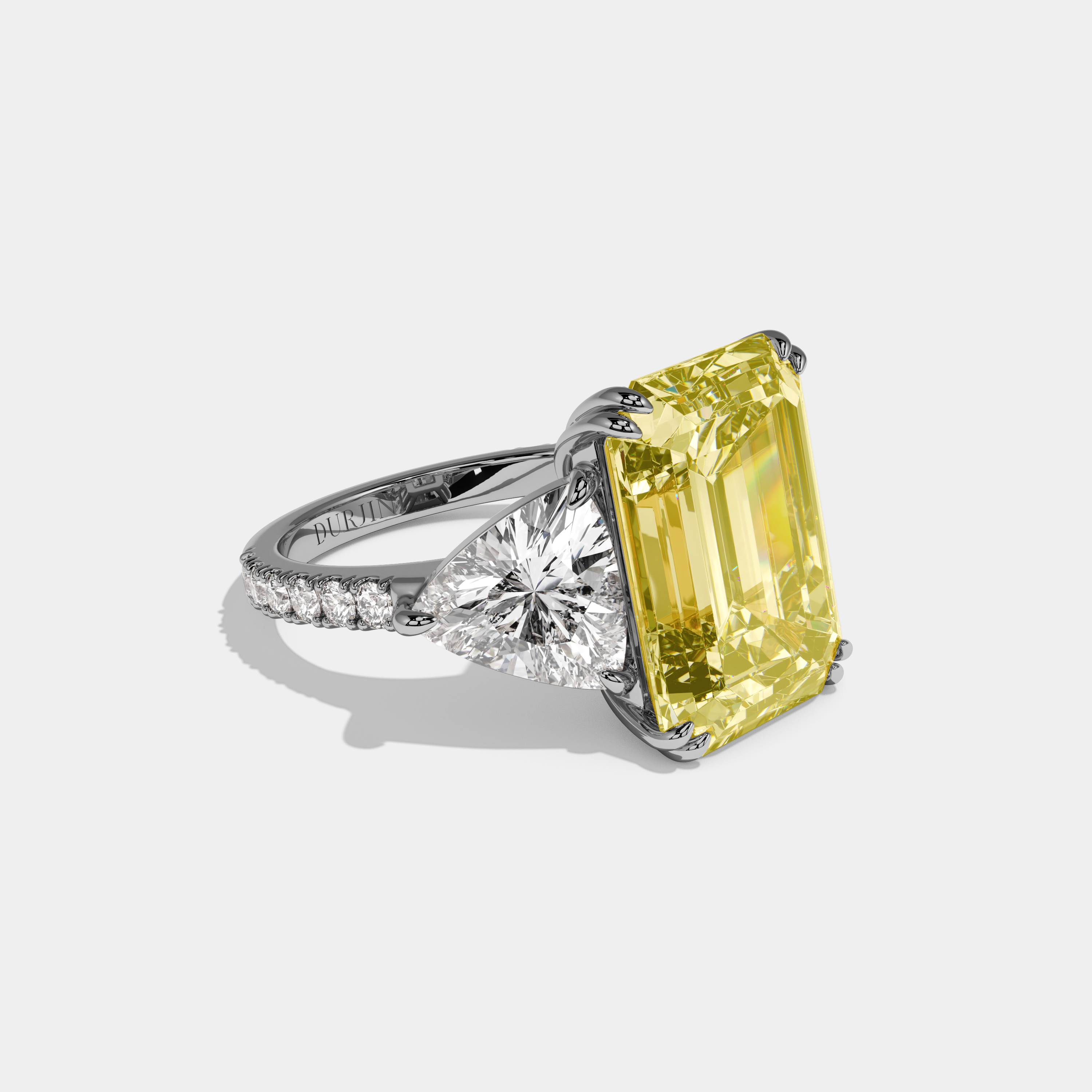 Vionnet Fancy Yellow Emerald Cut Diamond Halo Engagement Ring With Twin Trillion Cut Sides 10ct 18K White Gold