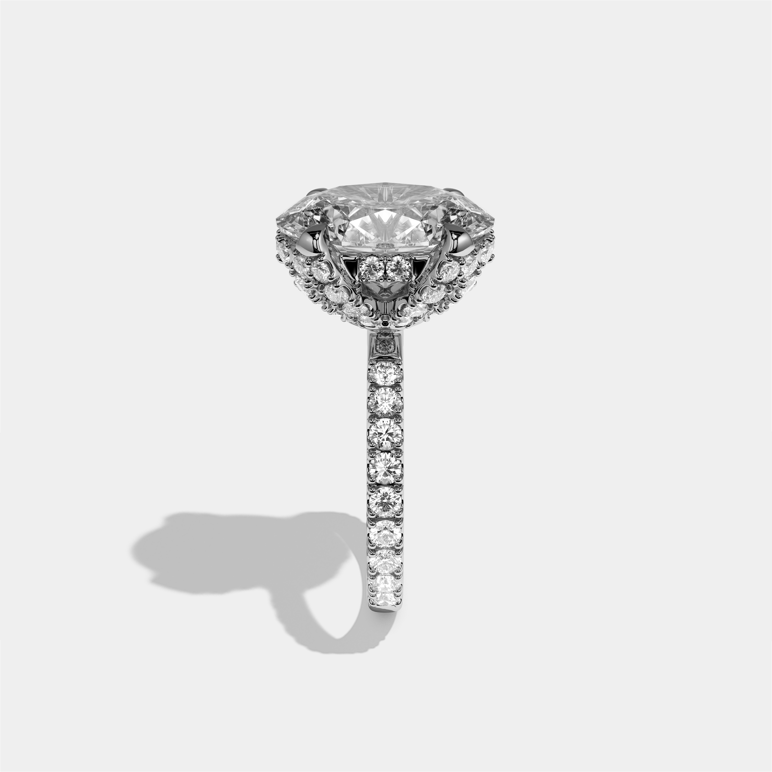 Rebecca diamond oval halo engagement ring in 18K white gold by Kurbãni Durjini, side view