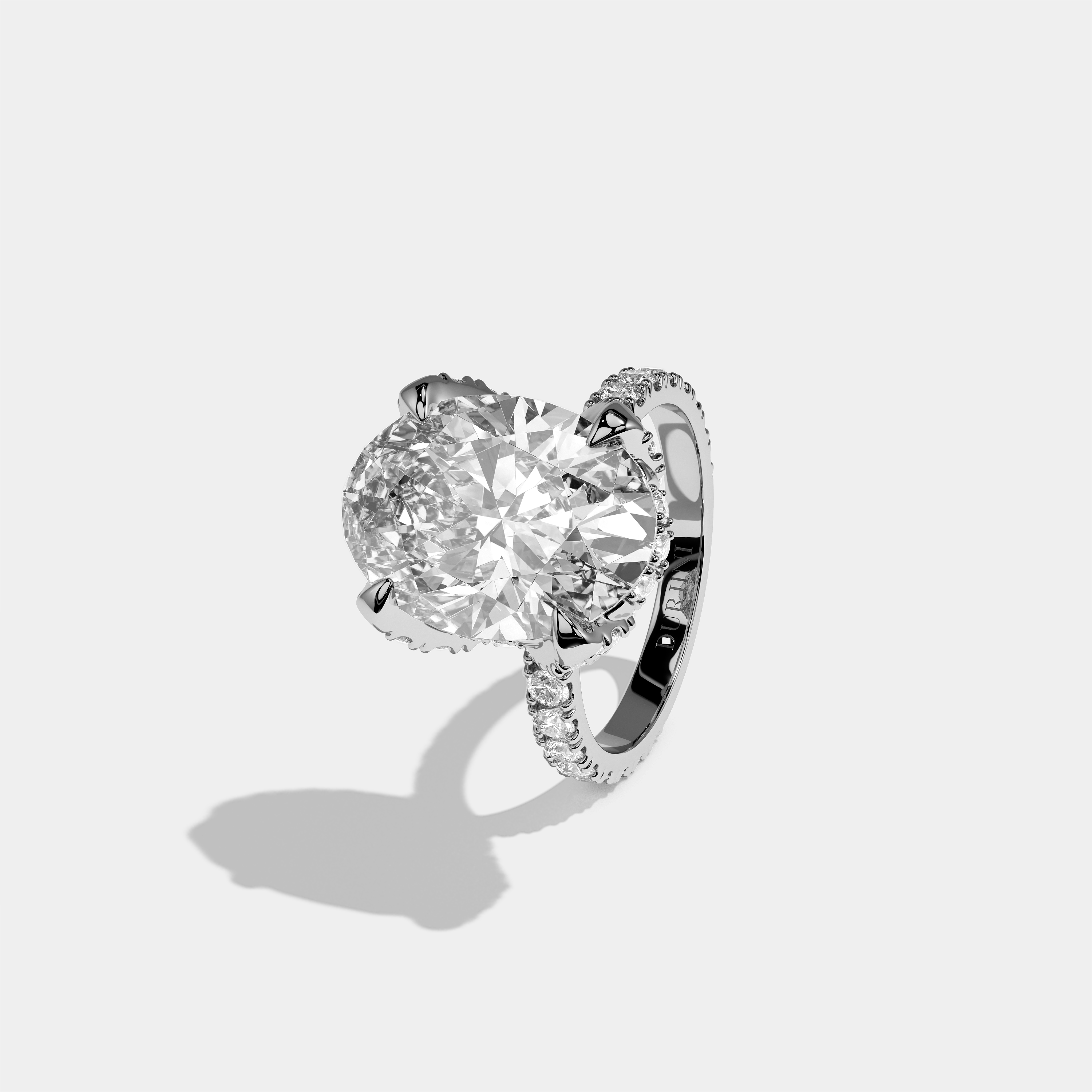 Rebecca diamond oval halo engagement ring in 18K white gold by Kurbãni Durjini, left view