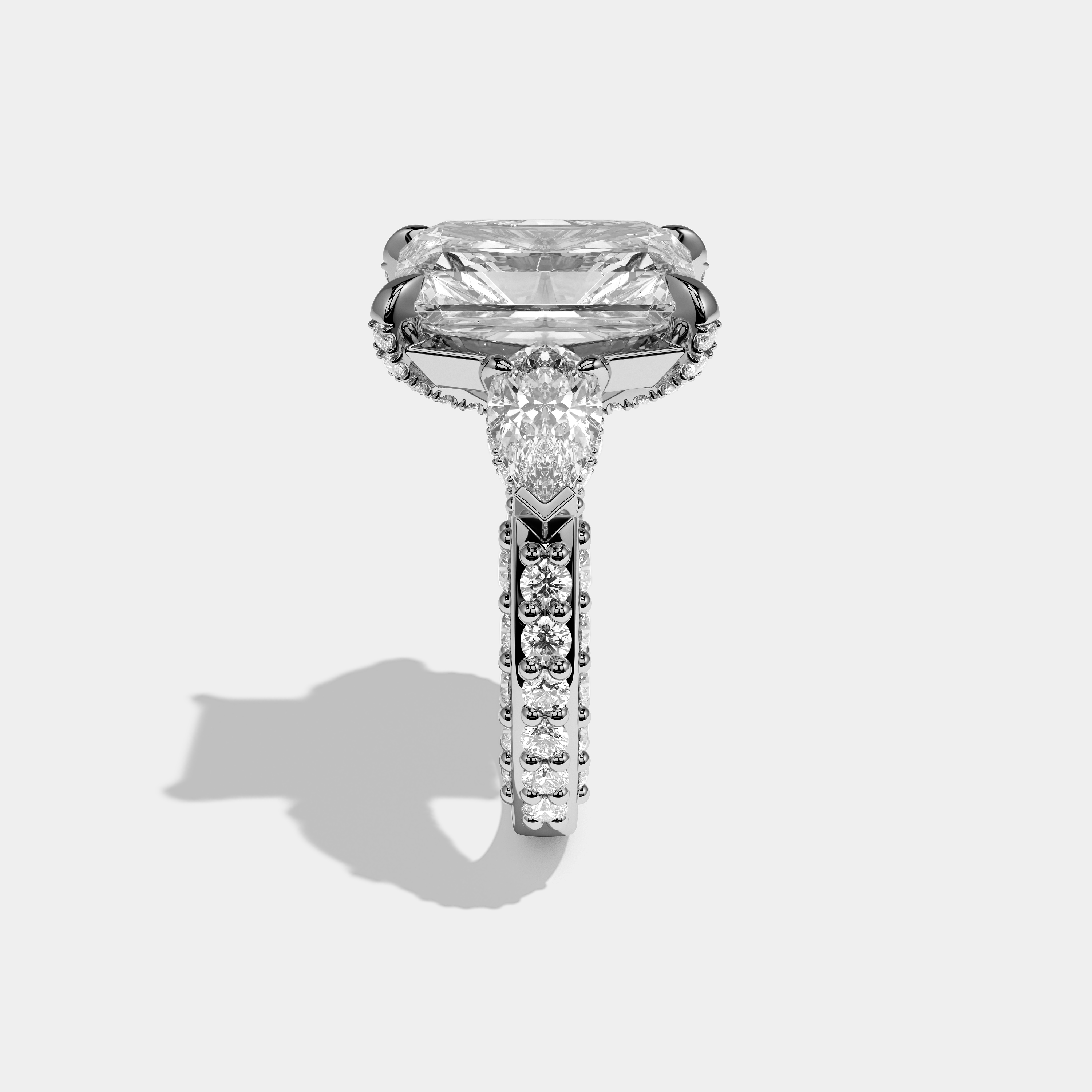 Hannah Eclat diamond radiant halo engagement ring in 18K white gold by Kurbãni Durjini, side view