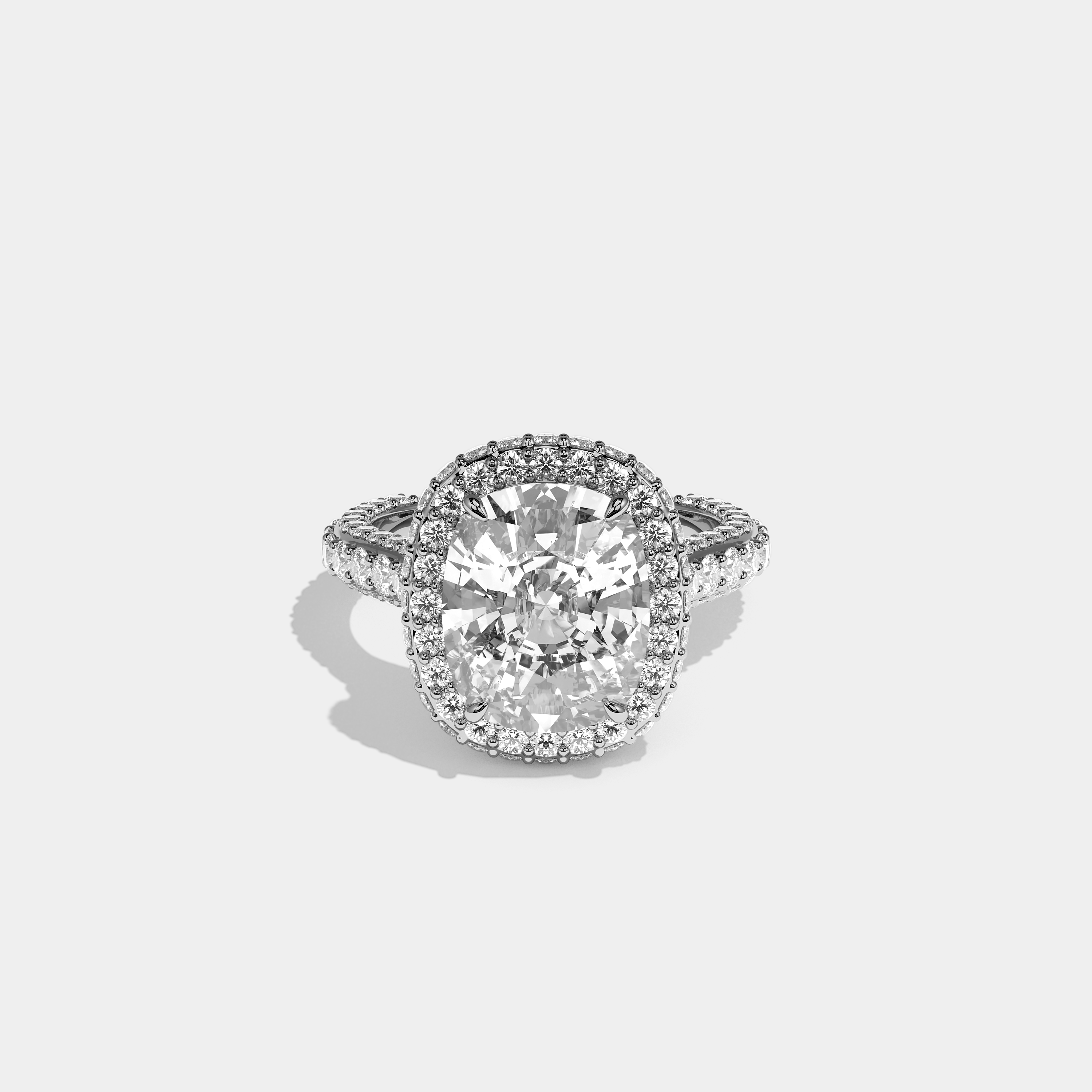Shira diamond cushion halo engagement ring in 18K white gold by Kurbãni Durjini, front view