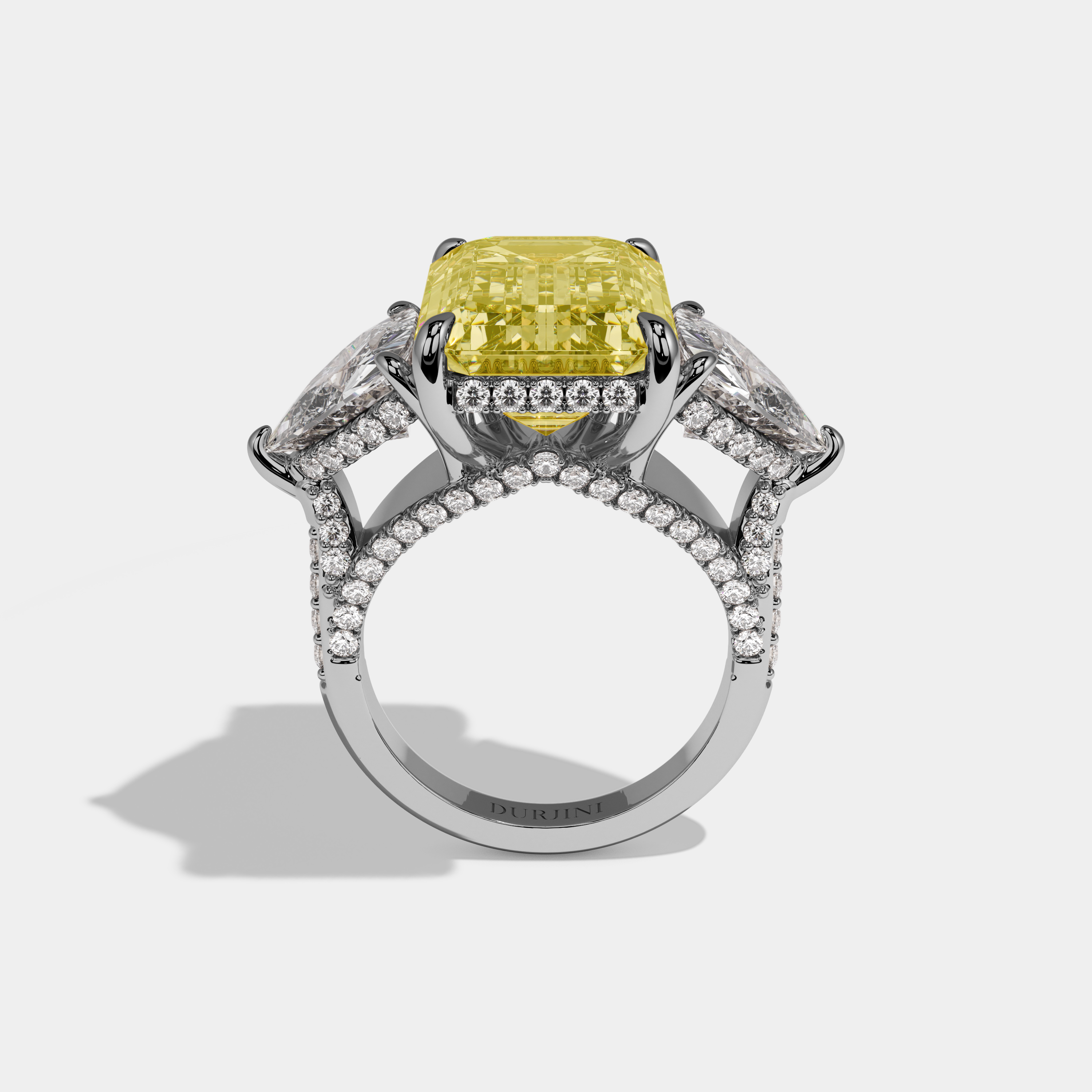 Charlotte Fancy Yellow Emerald Cut Diamond Halo With Twin Trillion Cut Sides Engagement Ring 10ct 18k White Gold